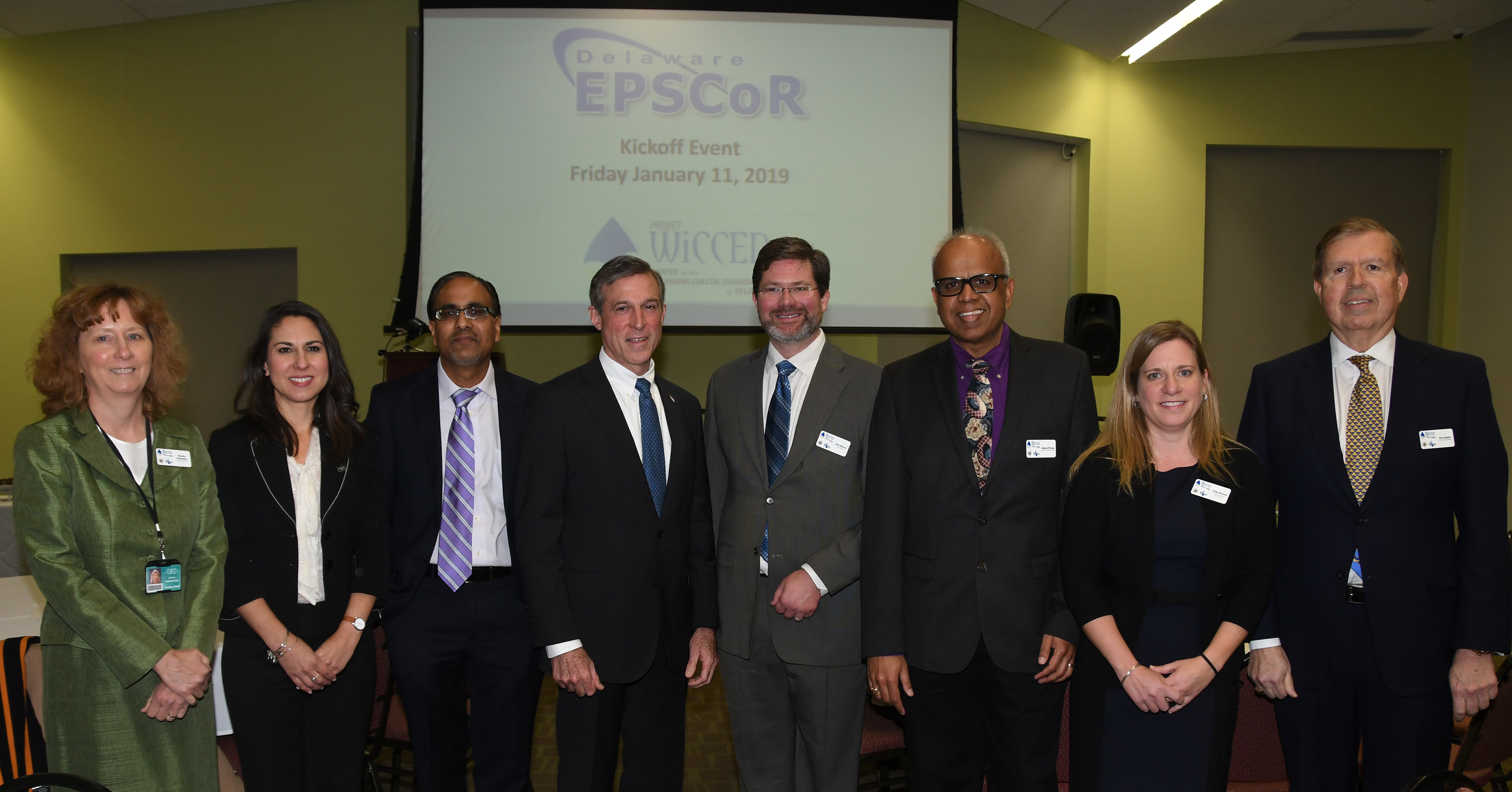 Delaware EPSCoR leadership: (L-r) Martha Hofstetter, DTCC Institutional Lead; Justina Sapna, DTCC VP for Academic Affairs; Venu Kalavacharla, DSU Institutional Lead and Co-PI; Gov. John Carney; Kent Messer, Project Director, and PI; Malcolm D’Souza, Wesley Institutional Lead, and Co-PI; Holly Michael, Research Lead and Co-PI; Donald Sparks, Delaware EPSCoR Director, and Co-PI.