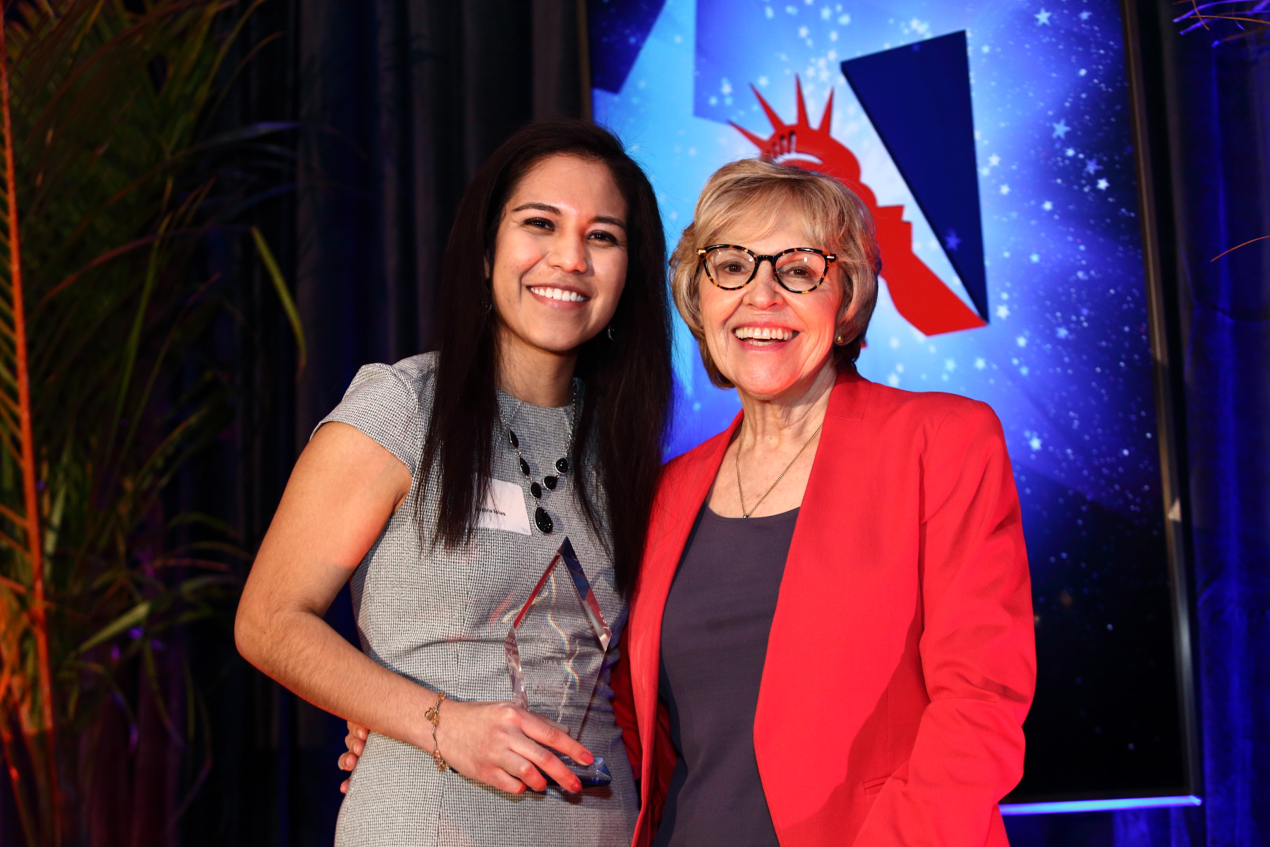 Indira Islas (l), with her Holly Skolnick Human Rights Awards from the Americans for Immigrant Justice, stands with the Cheryl Little, the organization's executive director. Ms. Islas received the award at a Feb. 8 ceremony in Miami, Fla.