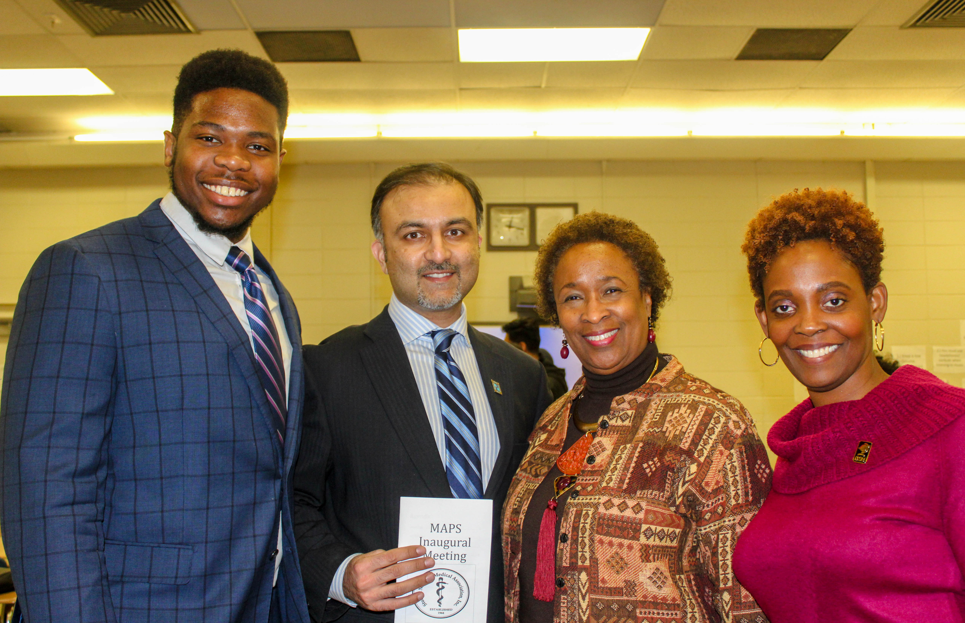 (L-r) Jared Jeffrey, biological sciences major, Dr. Omar Khan of Christiana Care, Dr. Marsha Horton, Dean of the College of Health & Behavioral Sciences, and Dr. Jacqueline Washington, Associate Dean of the same college, pose for a photo after the recent inaugural meeting of the University's Minority Association of Pre-medical Students