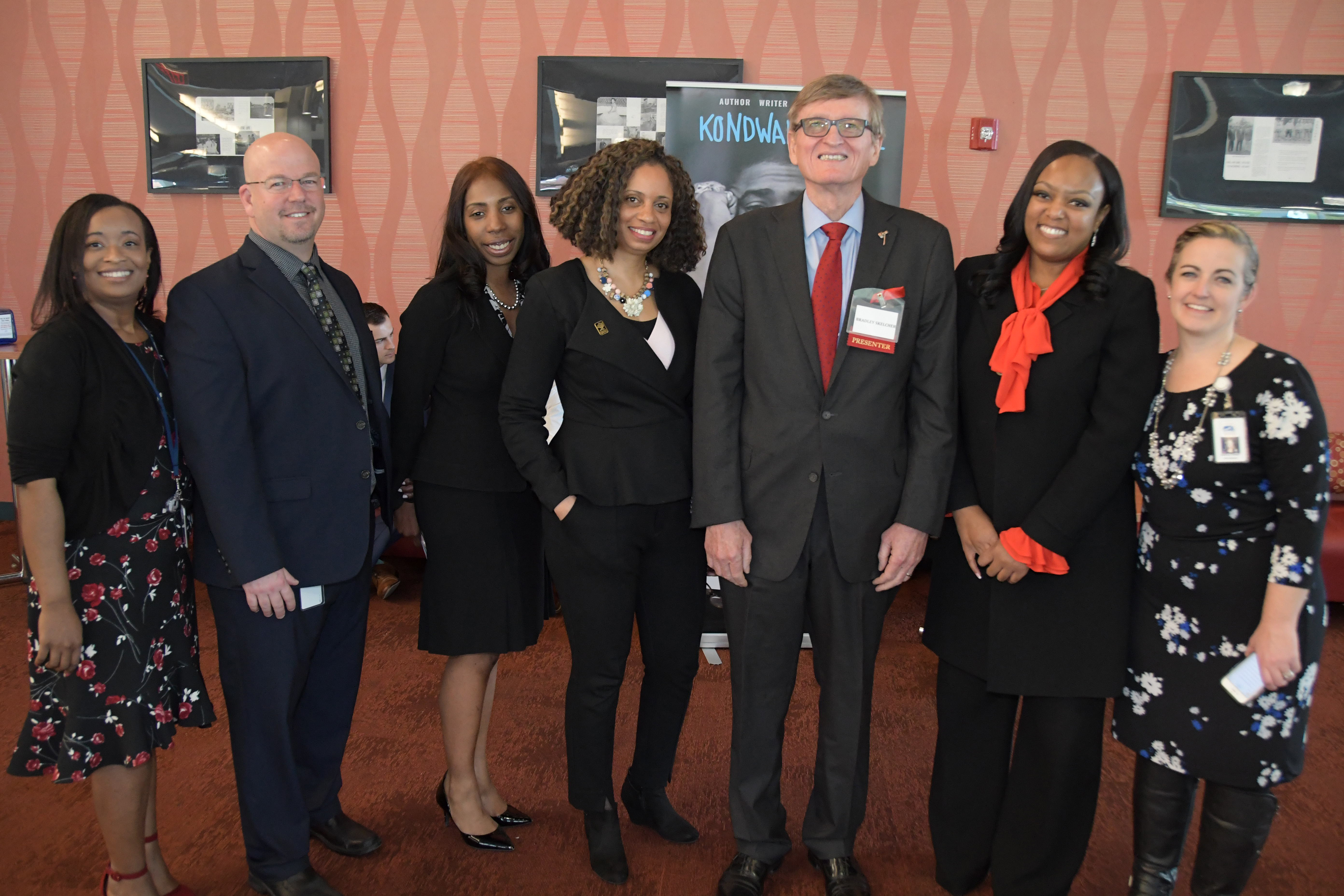 DOE's Tiffany Cireen Jon Nembauer, Raushawn, Shelly Rouser, retired University Associate Provost Bradley Skelcher and Education Department Chair Shelley Rouser, DOE's Monique Martin and Shannon Holston gather for a photo during the summit.