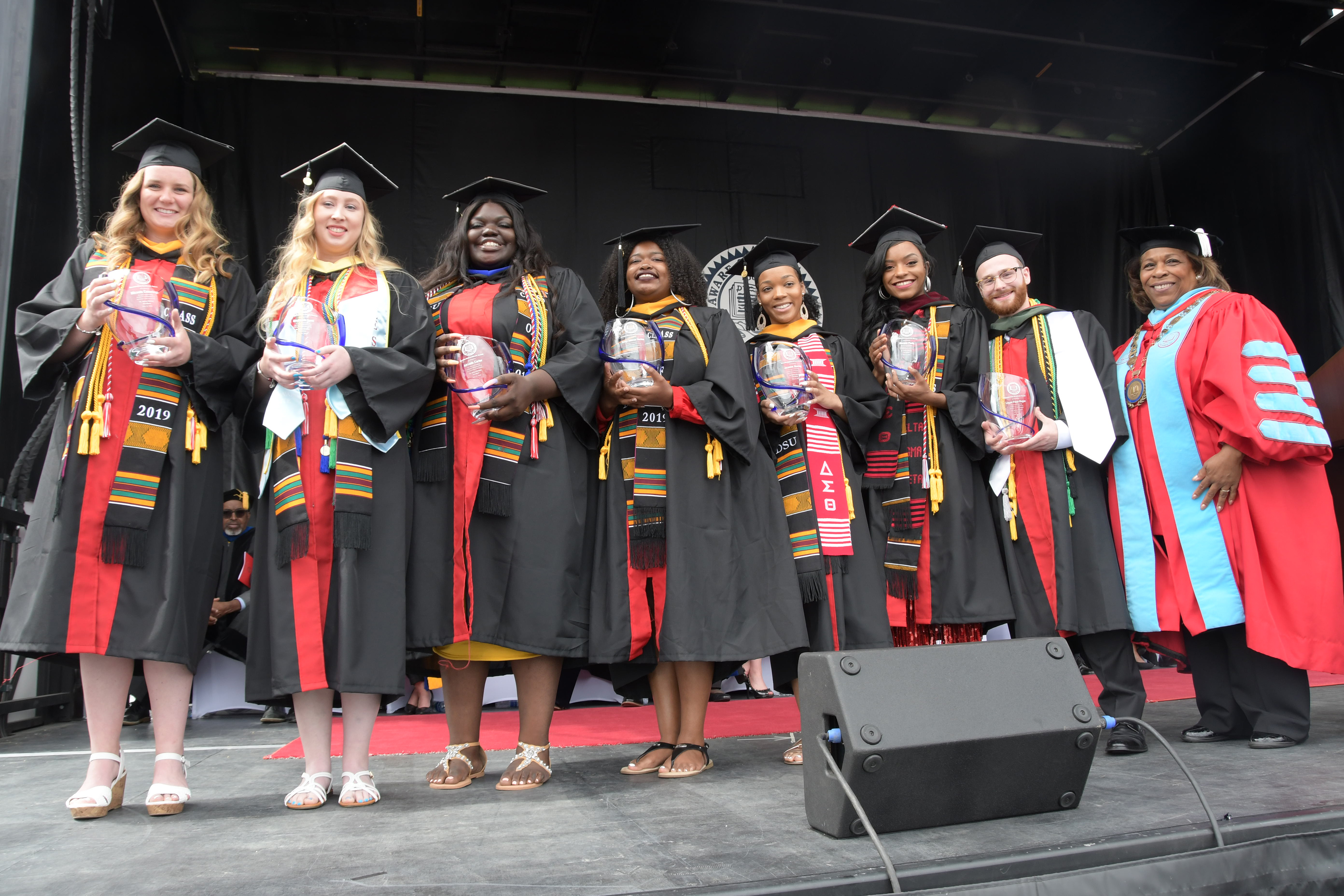 Seven 4.0 GPA graduates -- (l-r) Micaela Cummings, Stephanie Lynn, Adriante Carter, Jazmyn Robinson Stockton, Jasmine Herring, Morgan Poole and Logan Faux-Dugan -- all received the Presidential Academic Award from University President Wilma Mishoe (far right).