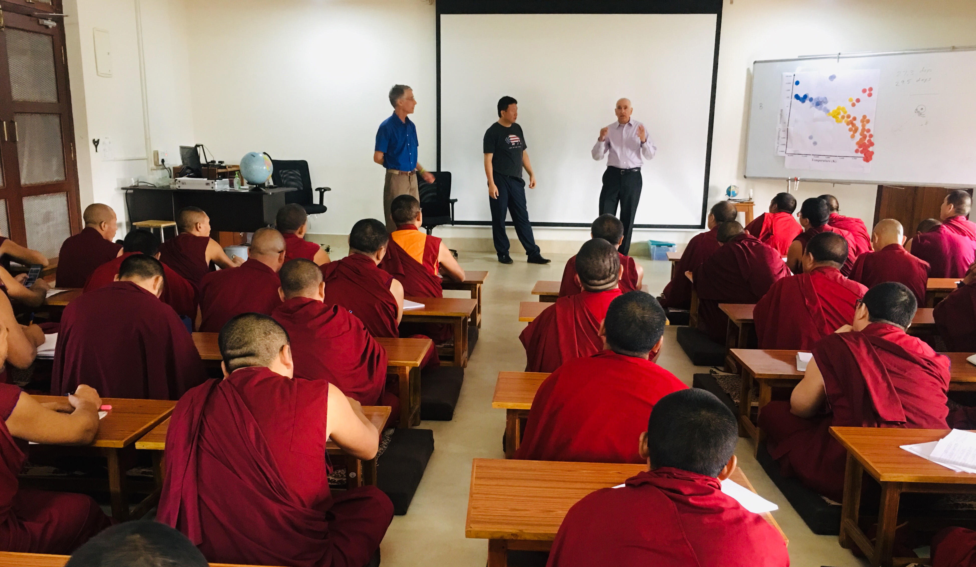 Dr. Matthew Bobrowsky, director of the DSU Observatory and Science Outreach, teaches astronomy to a group of about 70 Tibetan monks during a recent trip to India.