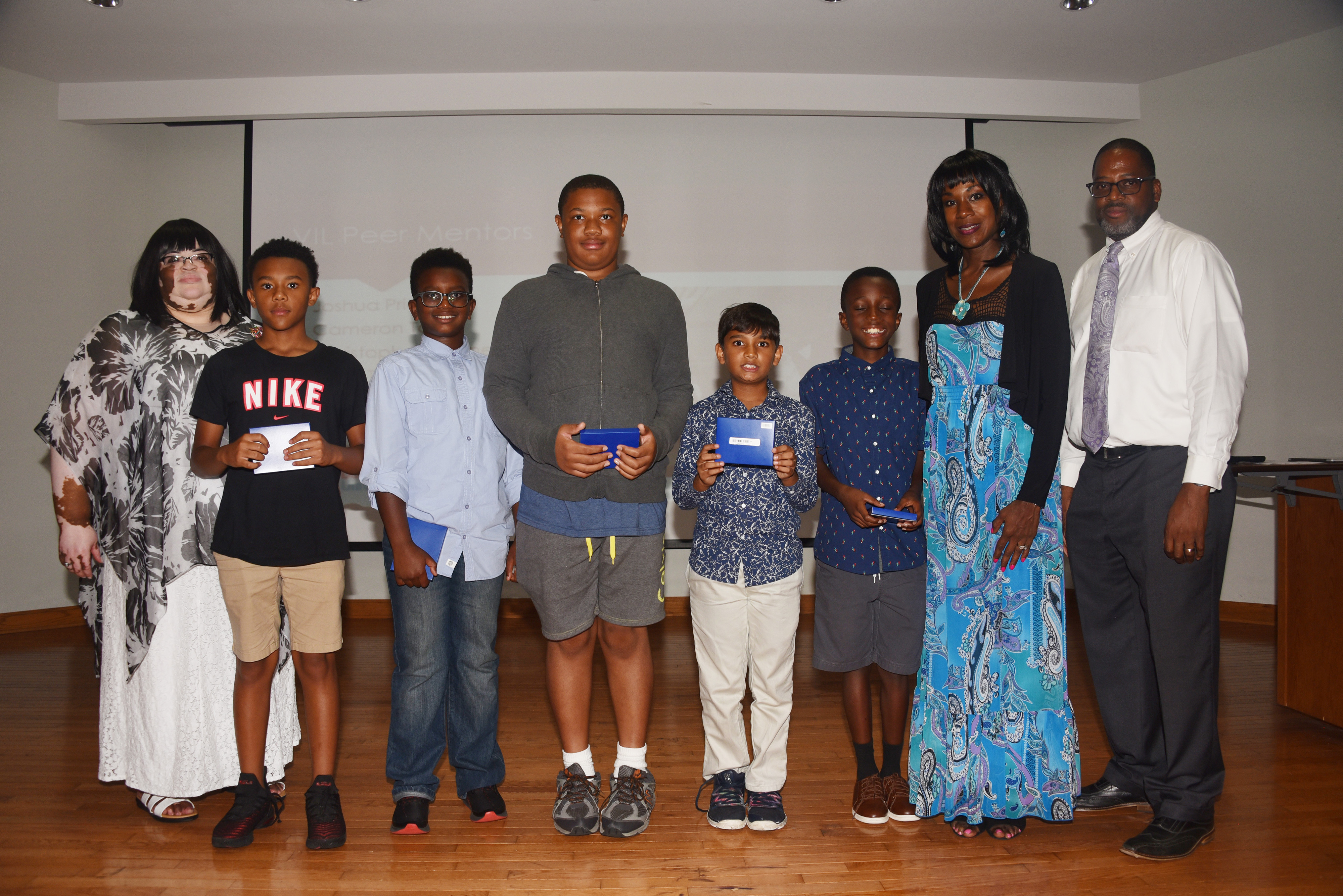 The Verizon Summer Camp's 1st place team -- The Thinkers. (L-r Dr. Charity Shockley, camp director; Thinker team members Xavier Gordy, Christian Auguste, Tristan Cooper, Vraj Shah and Kinte Tolson; and camp co-directors Lillie Crawford and Vaughn Hopkins.