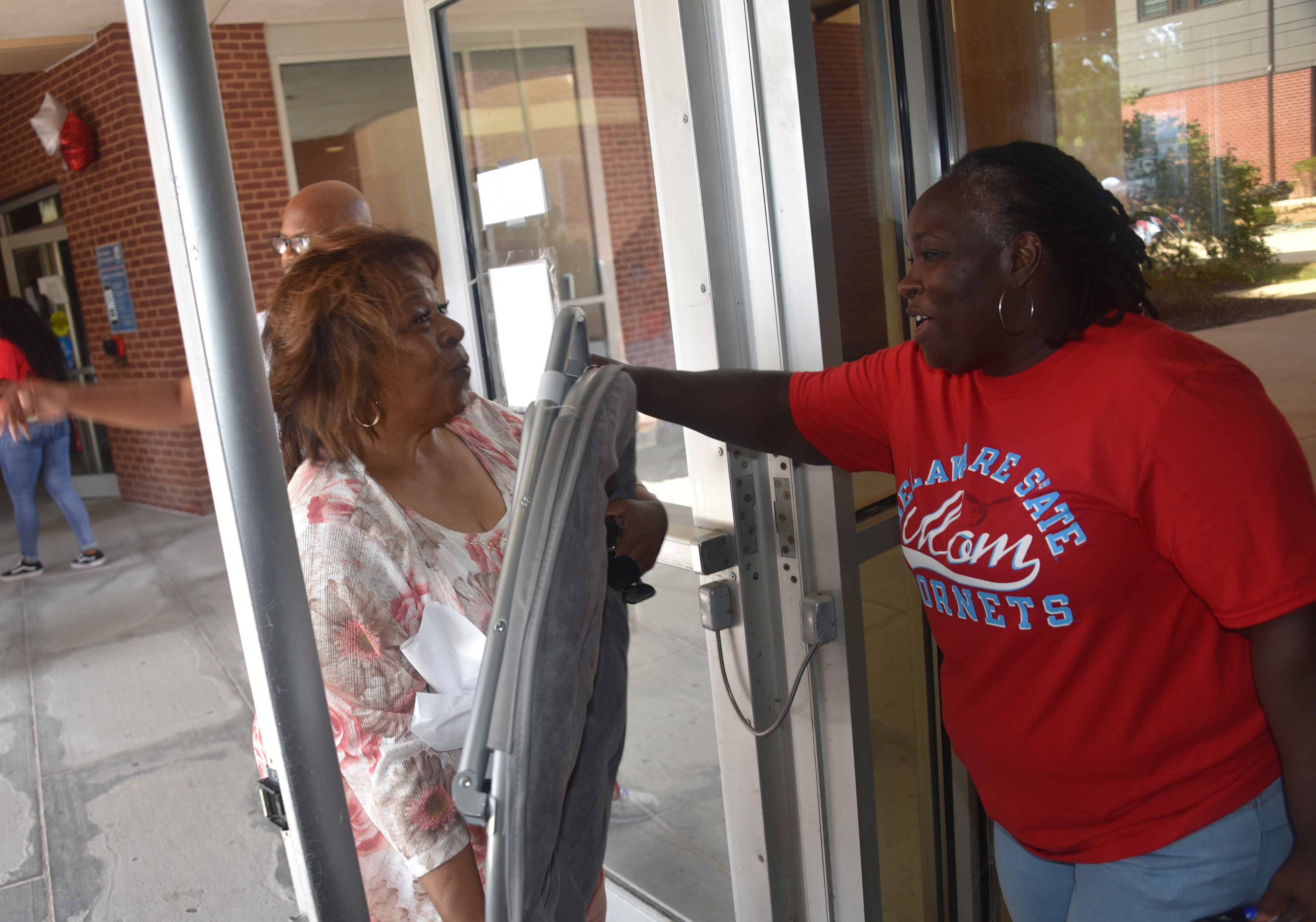 University President Wilma Mishoe even got into the volunteer work of helping students and the families move their belongings into the residential halls.