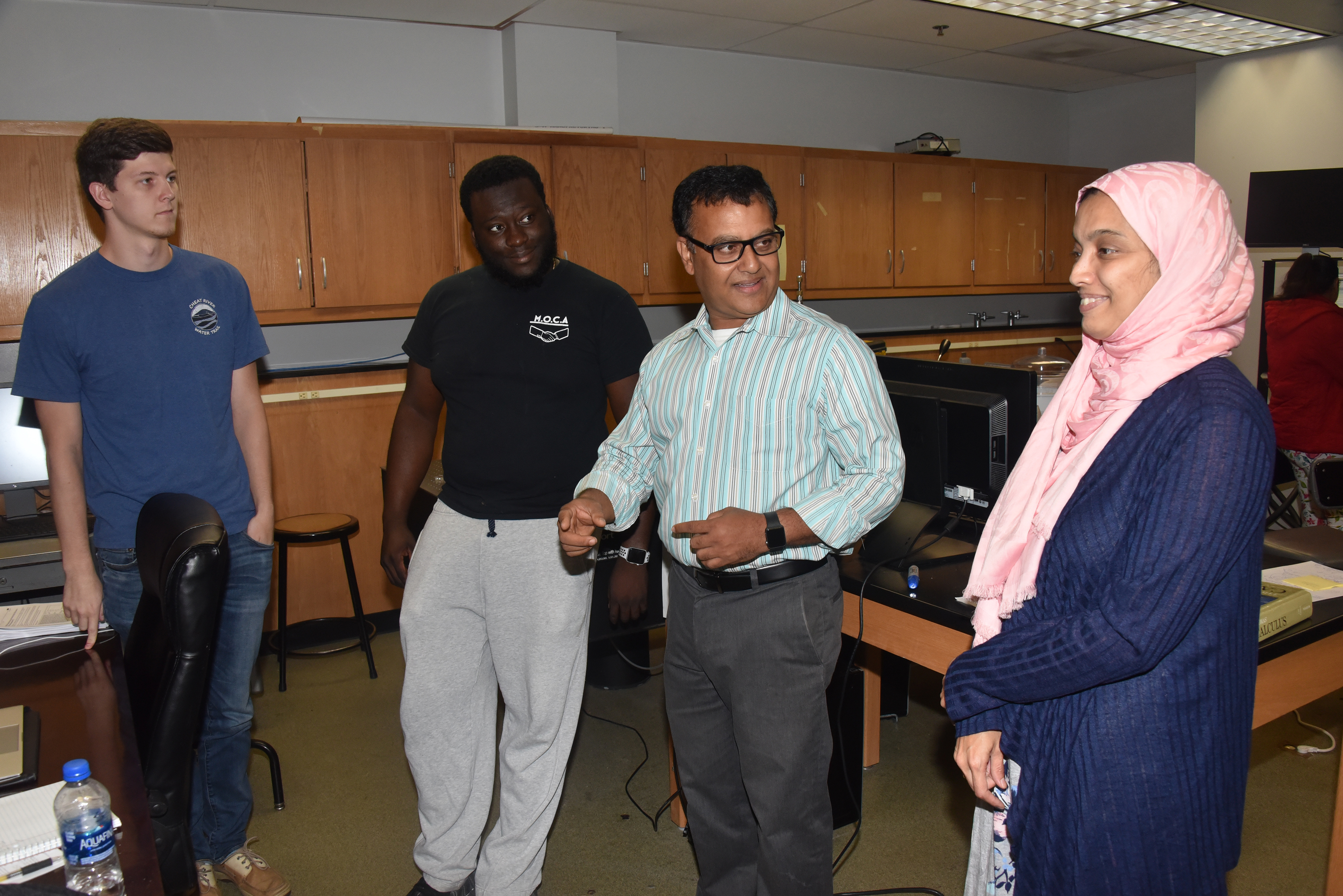 The DoD funded X-ray Diffraction System will not only be used for ongoing and future research project, but also it will be used an advanced technology that science students (like the ones Dr. Mukti Rana is chatting with here) can be exposed to and trained to use.