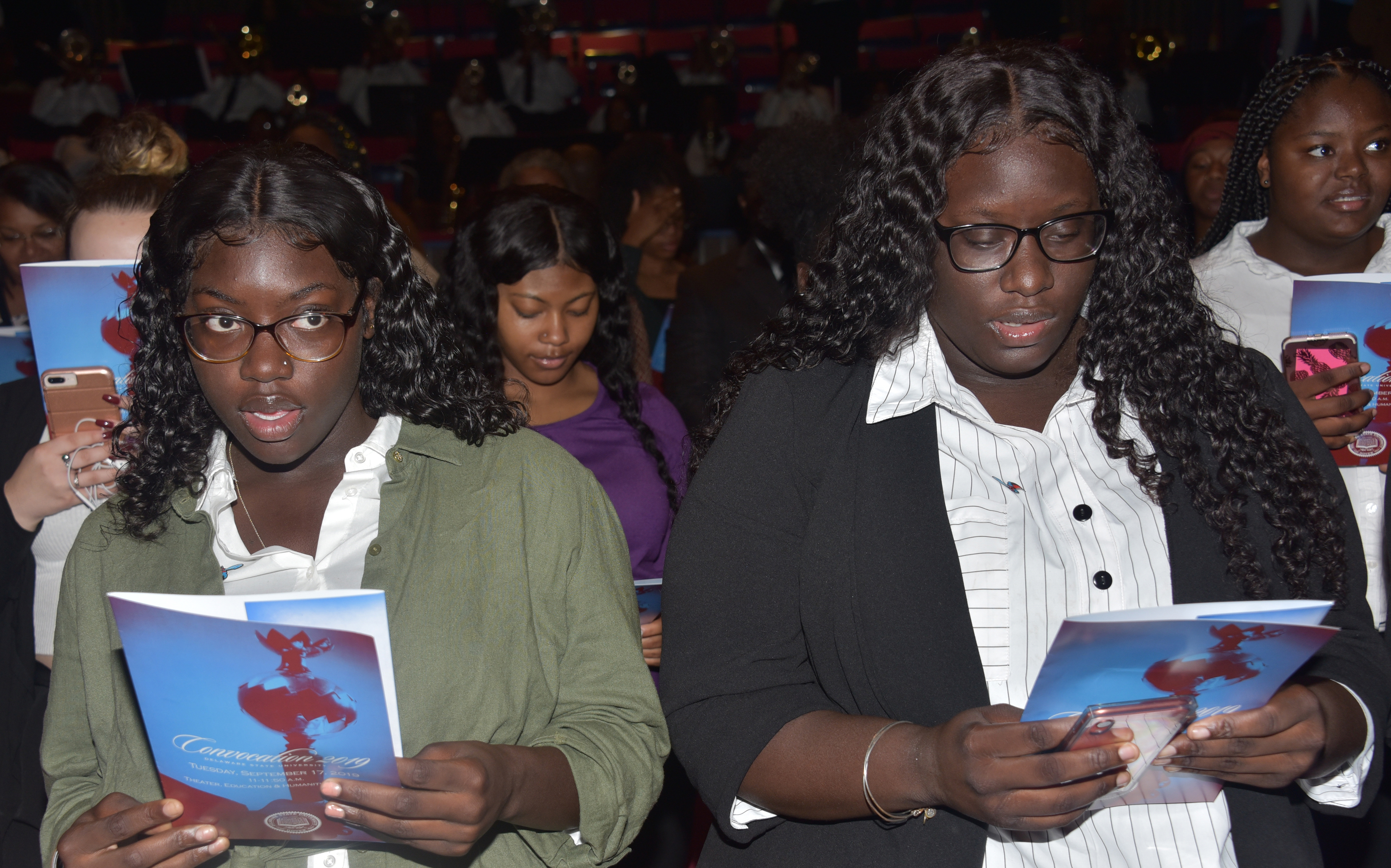 Two freshmen sing the University's Alma Mater at the end of the Sept. 19 Convocation Ceremony