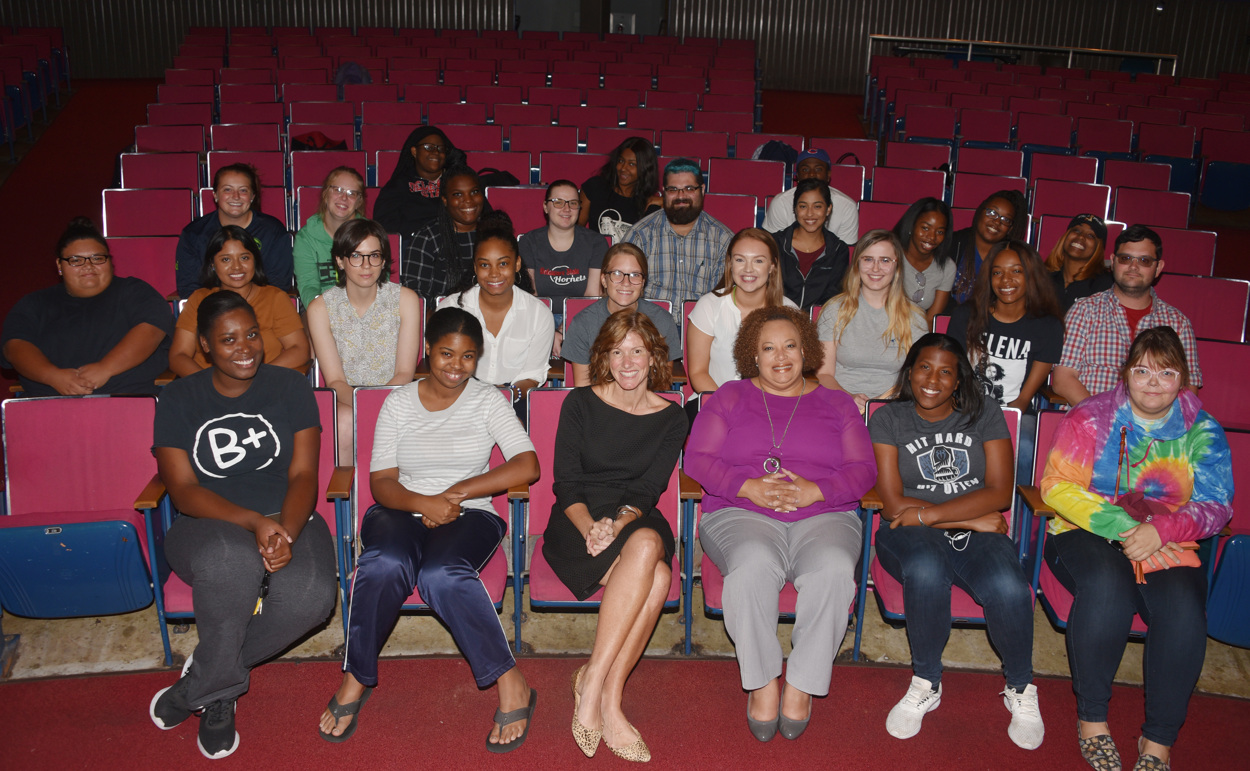 Dana Bowe (center front, black dress), 2019 Delaware Teacher of the Year, seated next to Dr. Crystal Timmons, director of Clinical and Field Experiences, poses with the education majors she shared her teaching experiences with on Sept. 25 in the Education and Humanities Theatre.