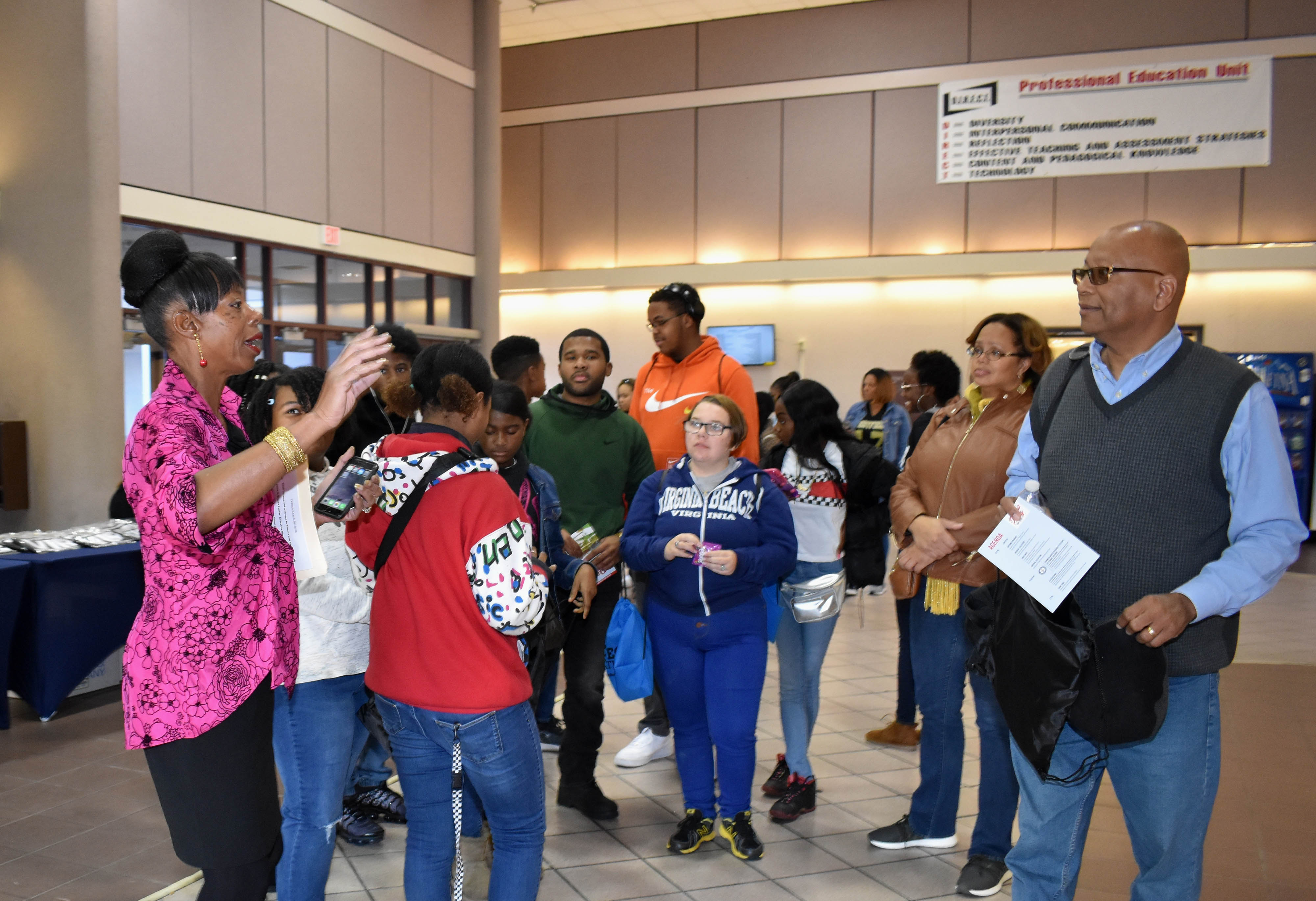 Brenda Farmer, executive director of Ceremonies and Events, gives instructions to the families attended Parents Day.