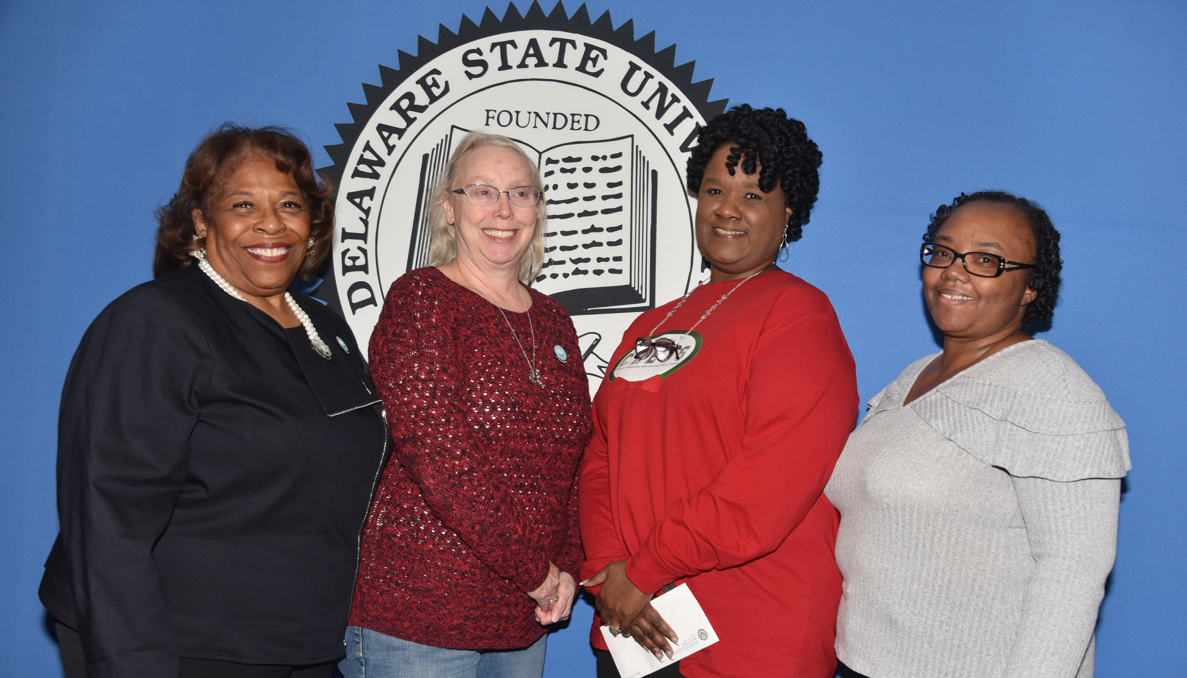 University President Wilma Mishoe stands with the 2019 Outstanding Service Award recipients.