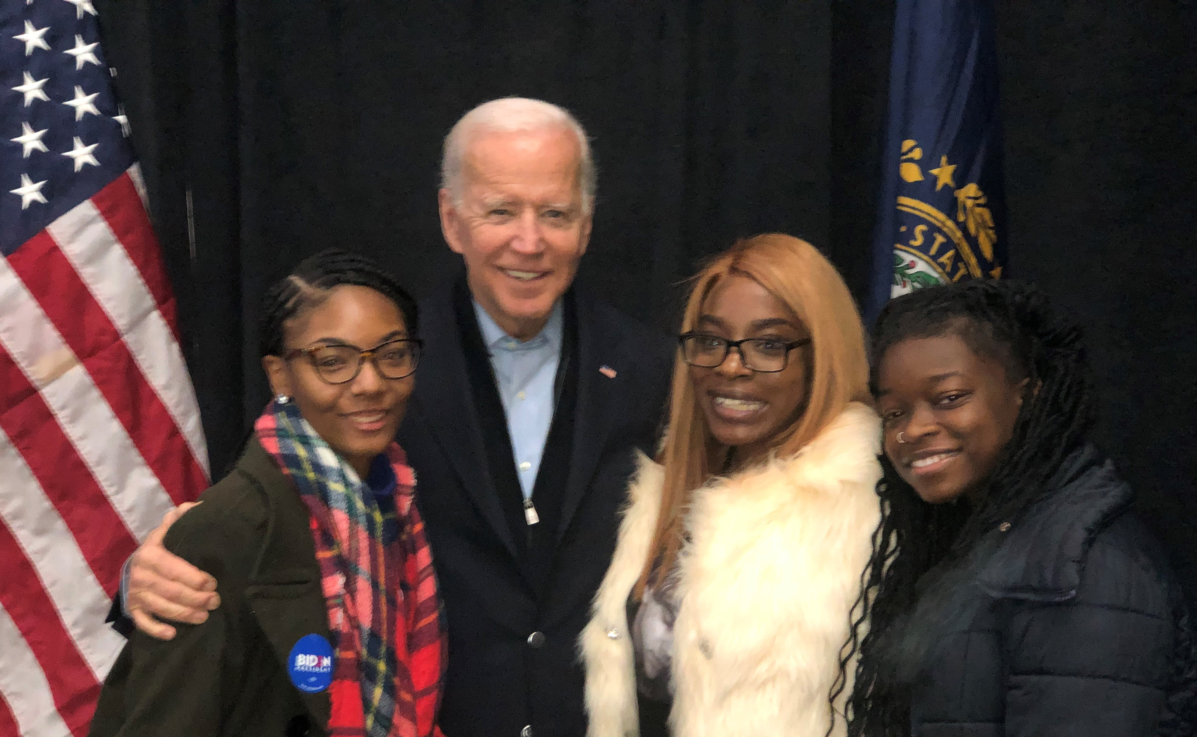 Presidential candidate and former Vice President Joe Biden pose with Delaware State University students (l-r) Da’Vonne Duncan, Folasade Olugbuyi, and Kendra Hand, who visited New Hampshire to experience the campaign environment.