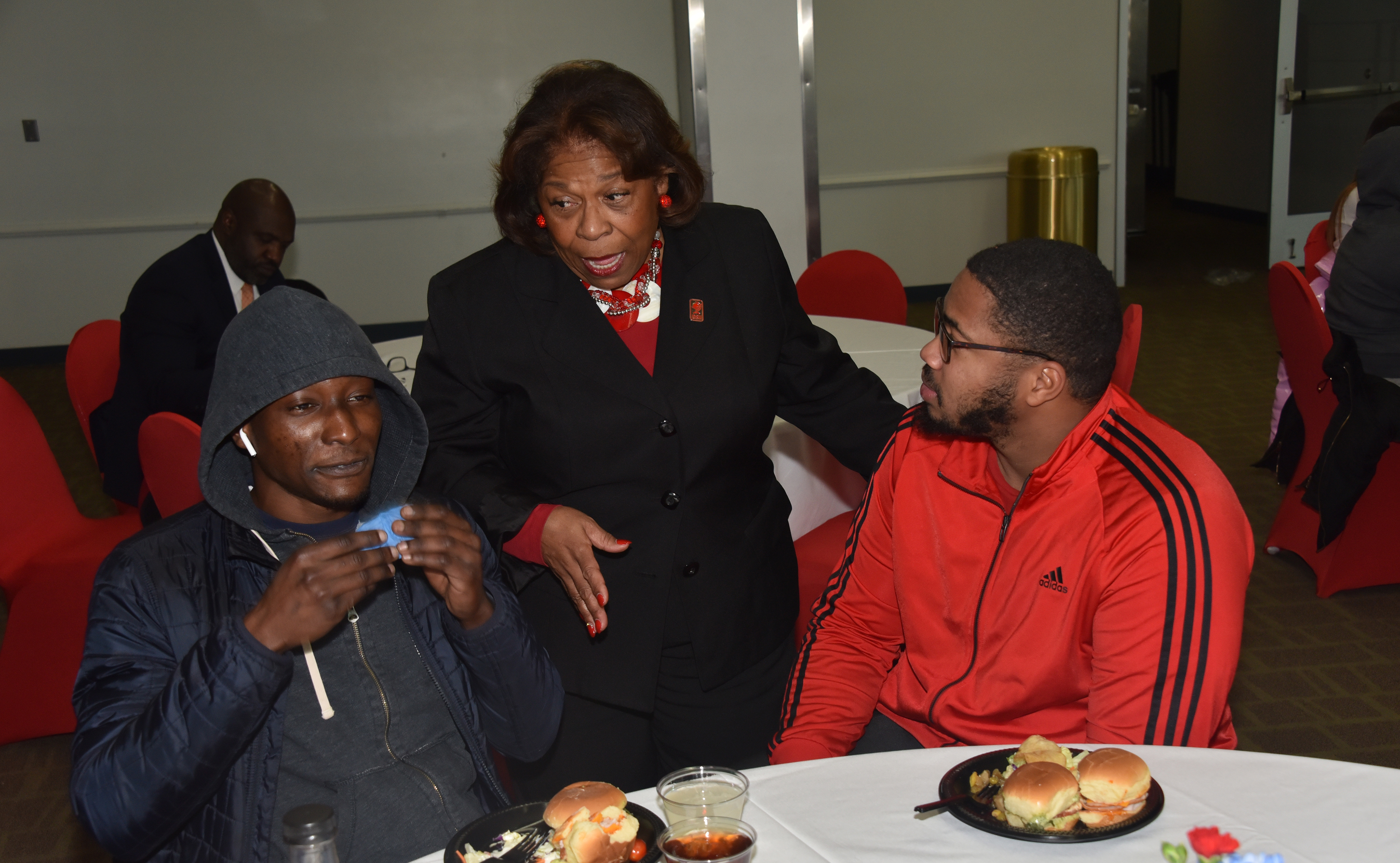 University President Wilma Mishoe chats with two graduating seniors during the Dec. 13 Senior Send-Off Reception in the MLK Jr. Student Center.