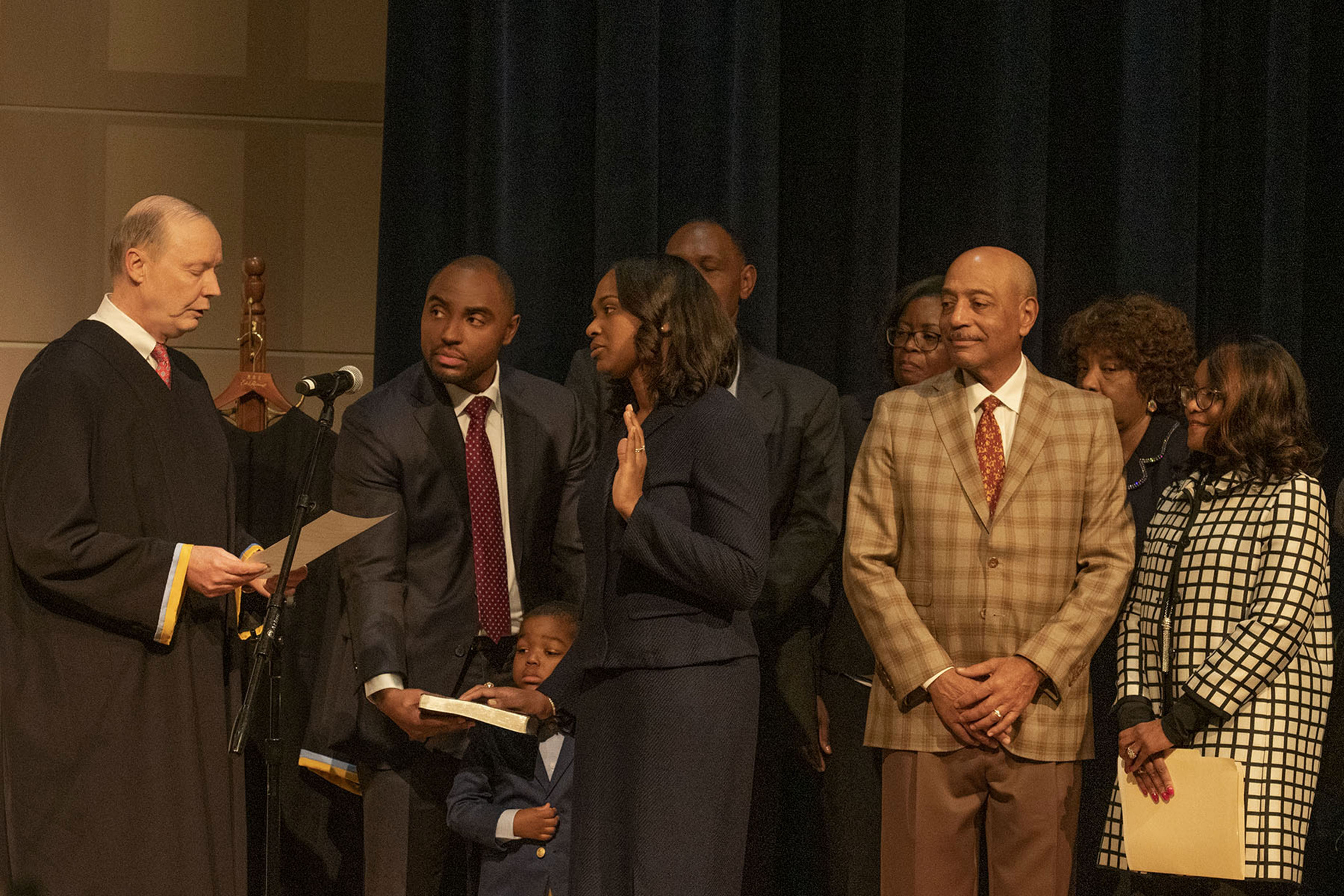 Tamika Montgomery-Reeves (with her hand raised) is sworn in by Delaware Supreme Court Chief Justice Colin Seitz, Jr. (l), as the first-ever African American to serve as an associate justice on the Delaware Supreme Court.