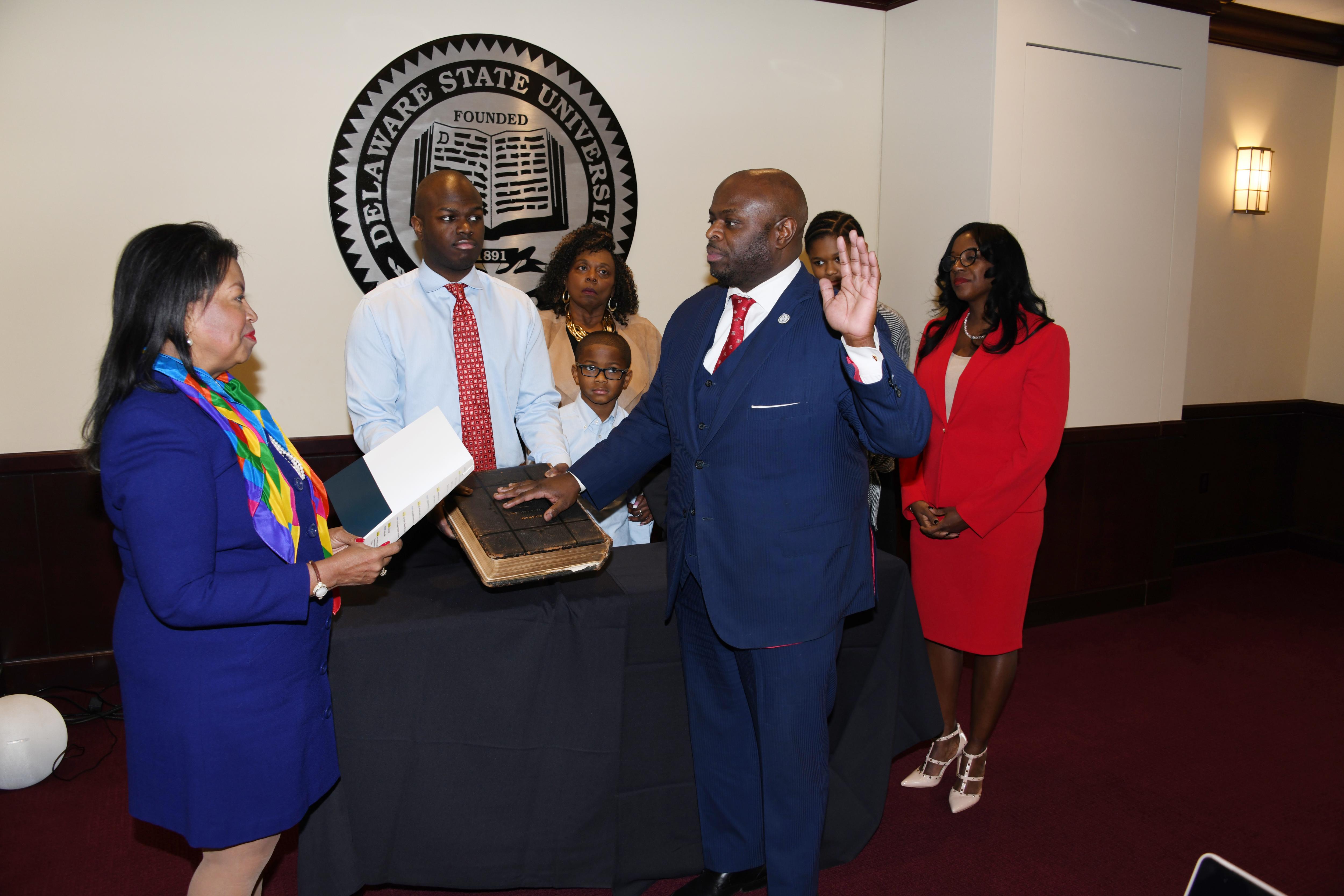 Board of Trustees Chairperson Devona Williams swears in Dr. Tony Allen as the 12th President of Delaware State University during the board Jan. 23 meeting.