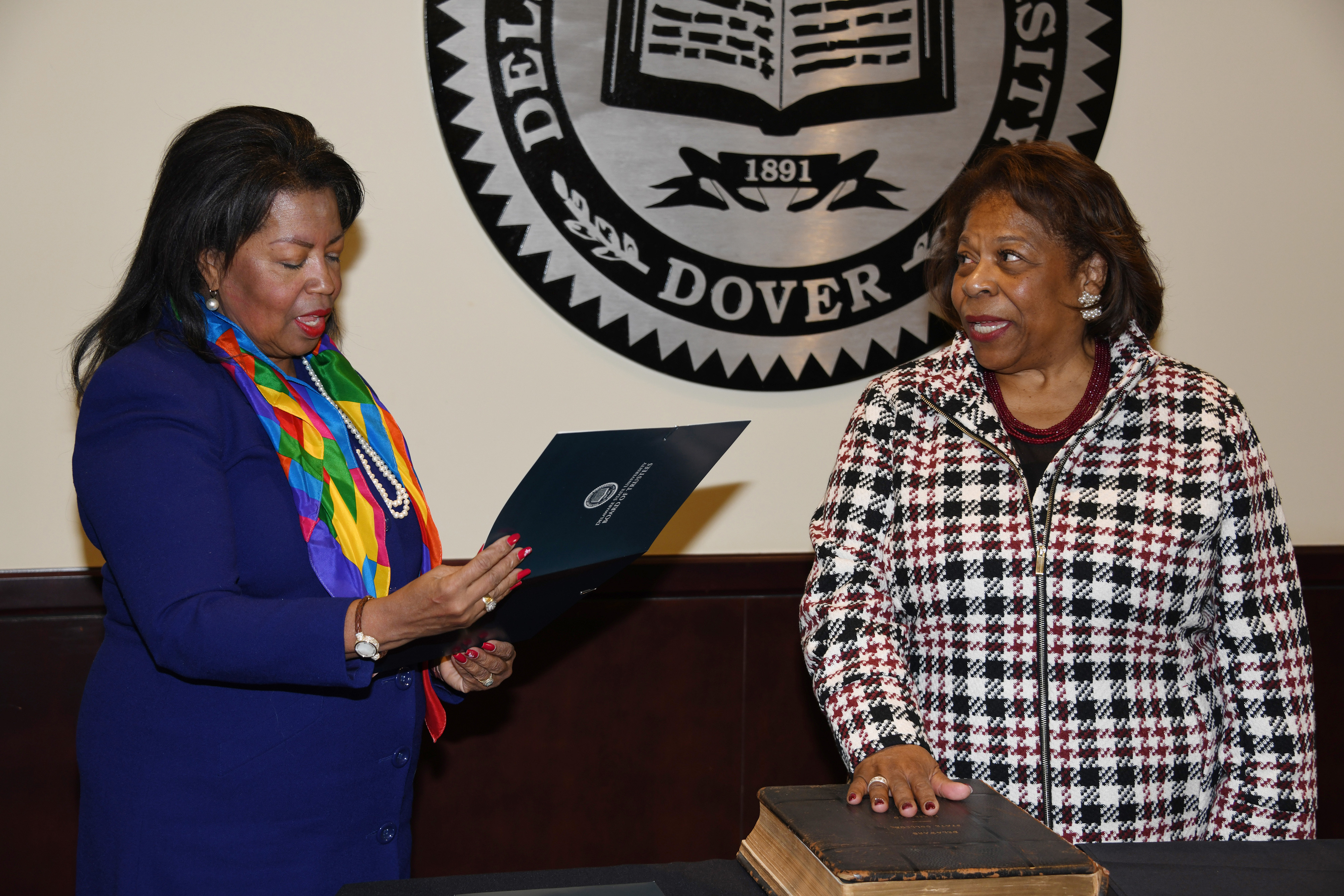 Dr. Devona Williams, Board Chairperson, swears in Dr. Wilma Mishoe as a Board member, resuming the board service that was interrupted by her elevation to University President from 2018-2019.