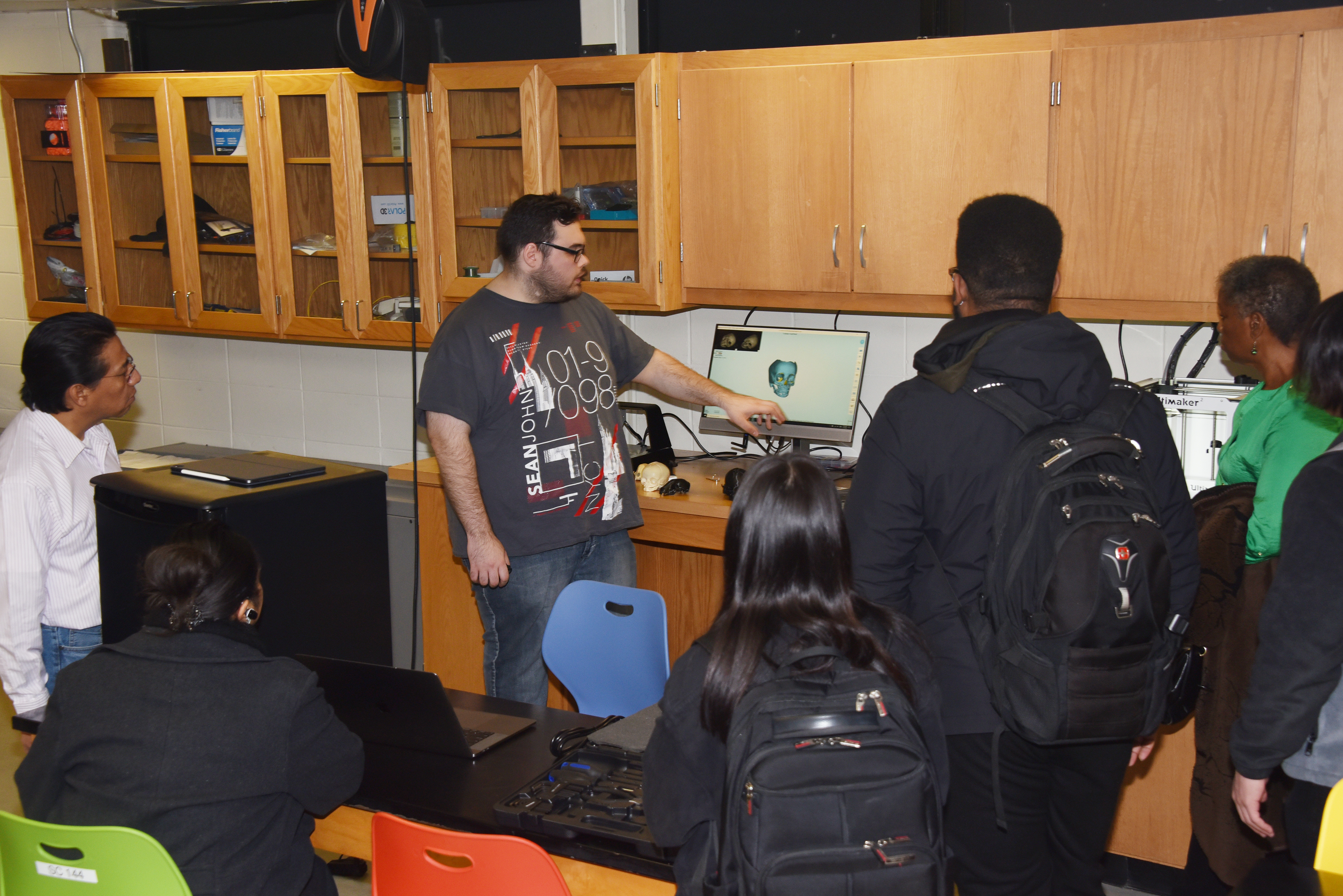 Rodrigo Lapenne, a junior information technology major, shows the capabilities of the 3D scanner during a Jan. 31 Open House held on the day the Makerspace was launched.