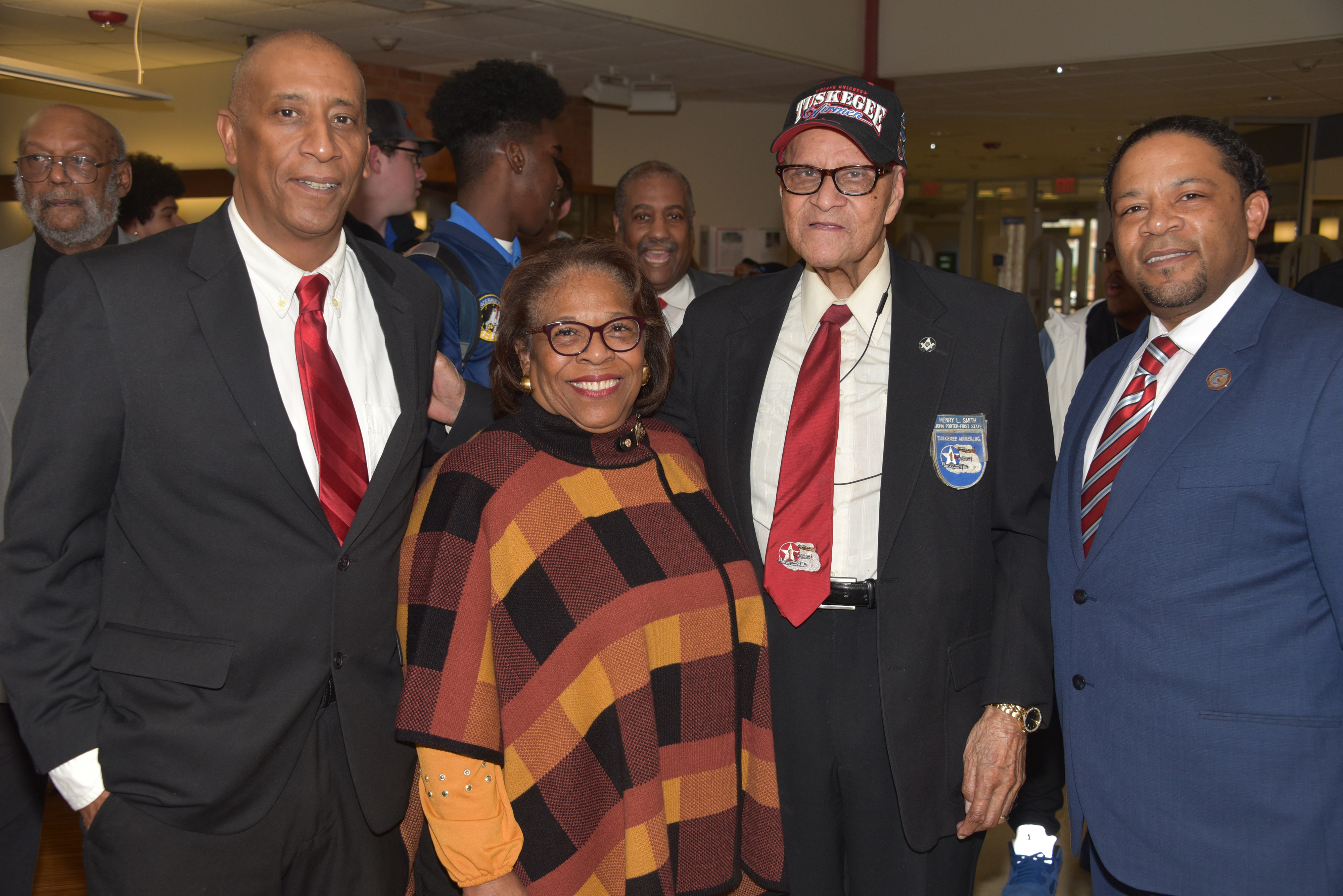 (L-r) Steven Smith, Dr. Wilma Mishoe, Henry Smith, and Travis Mishoe pose for a photo. Henry Smith talked about his time as a Tuskegee Airman during a program at the William C. Jason Library.