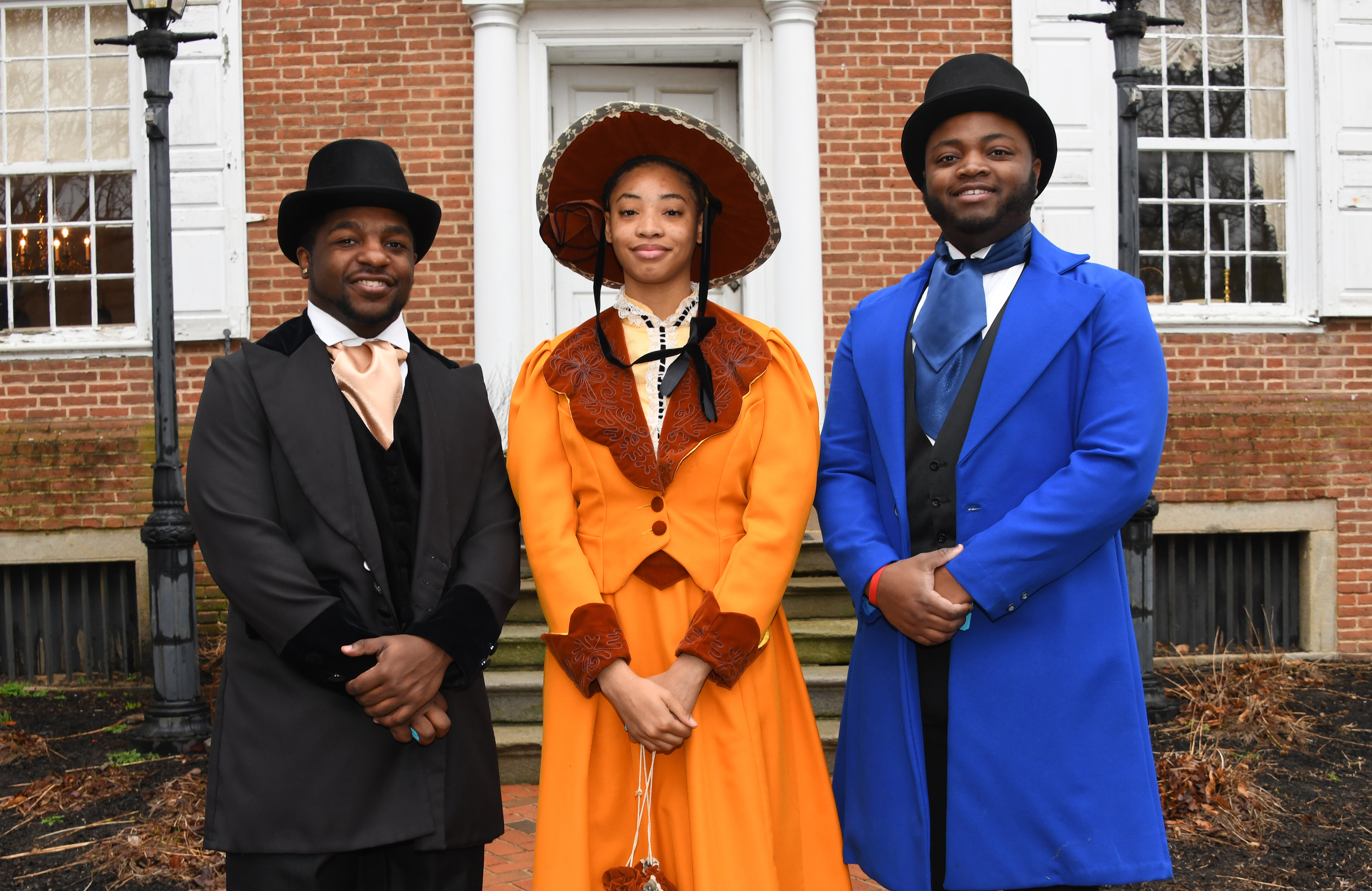 Del State students Tyler Brown, Bianca Laconte and Anthony McIver donned late-1800 outfits as part of the Loockerman Hall Open House on Founders' Day
