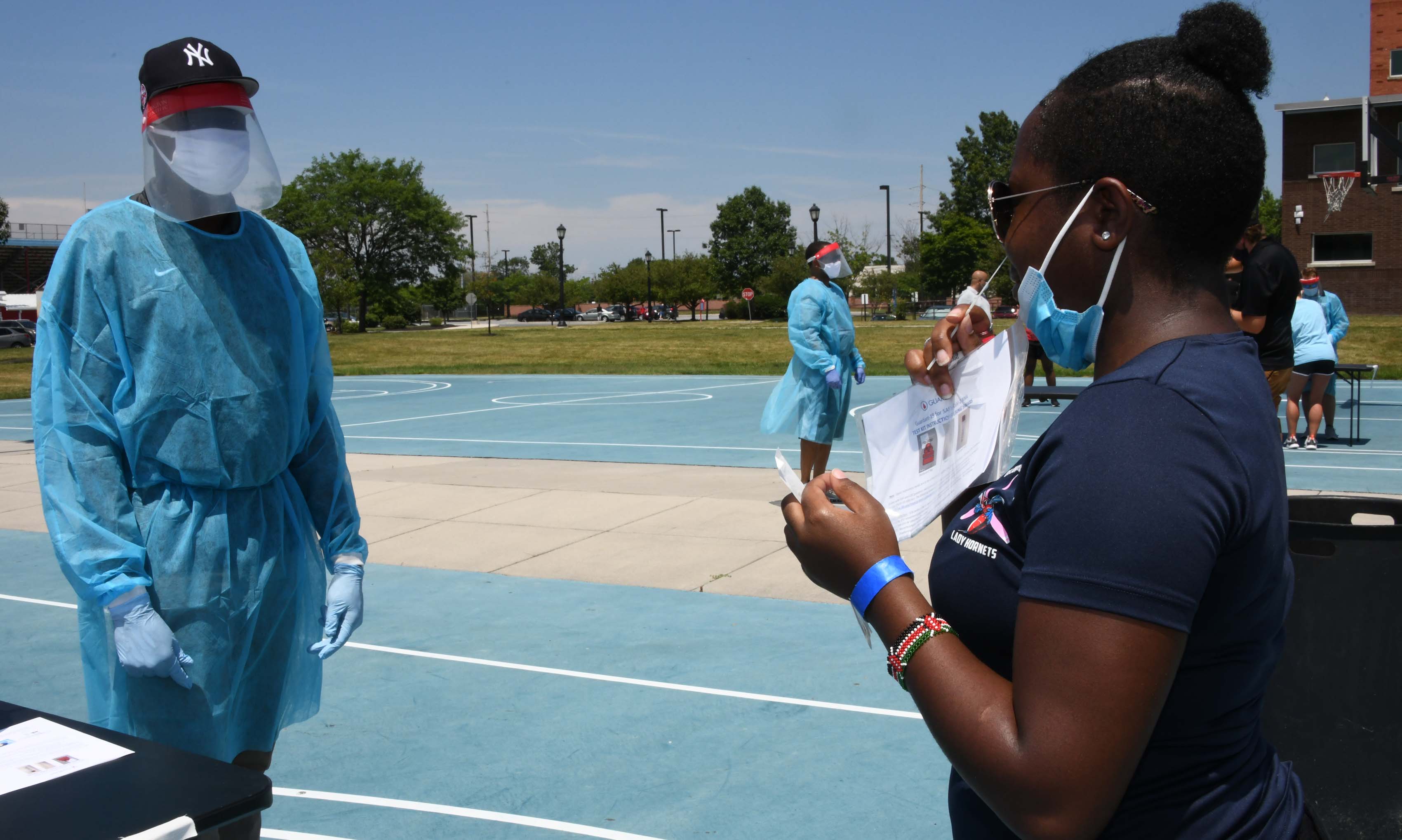 Aviation/Professional Pilot major Penni Kamani swipes the inside of her nostril for 20 seconds during the first day of testing at Del State.