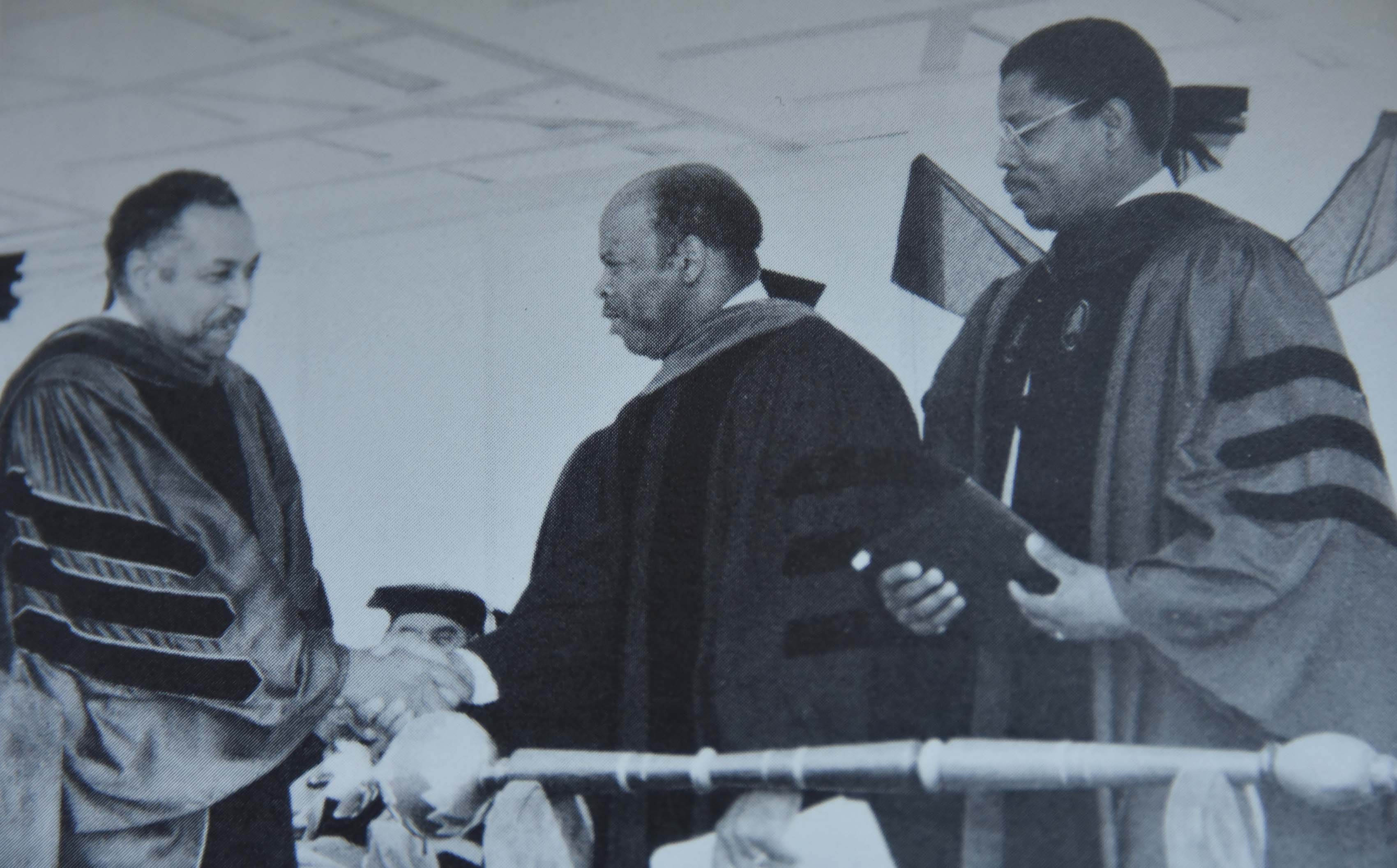 Congressman John R. Lewis -- shown shaking hands with Del State President William B. DeLauder with then-interim Vice President of Academic Affairs, Dr. Henry Tisdale looking on -- was the keynote speaker at Delaware State College's 1988 Commencement Ceremony.