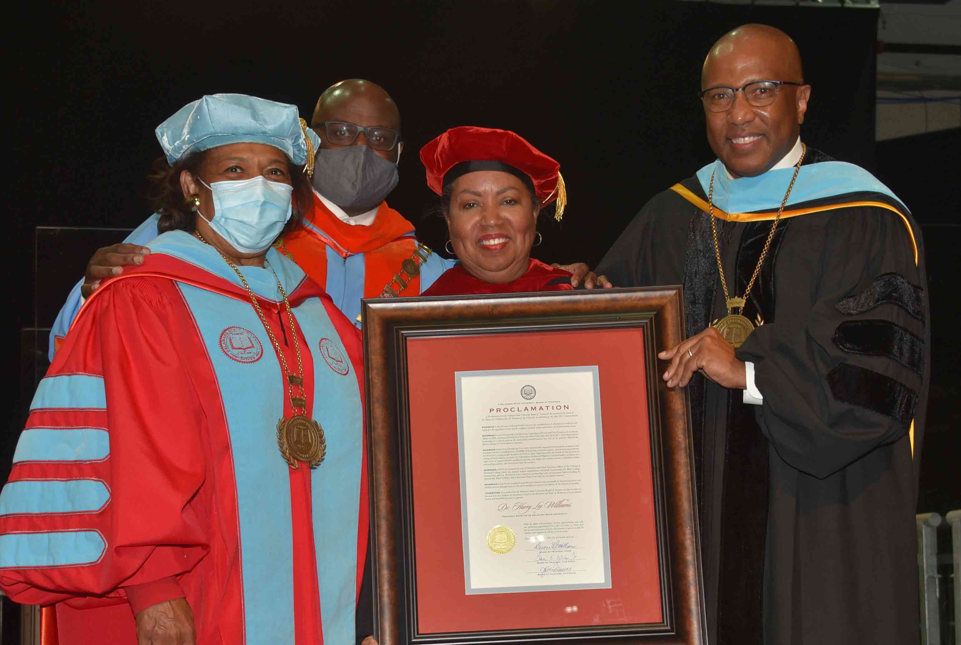 Dr. Harry L. Williams (r), the 10th president of Del State, was awarded President Emeritus status during the undergraduate Commencement ceremonies on May 8. Standing with him are Dr. Wilma Mishoe, Dr. Tony Allen and Board Chair Dr. Devona Williams.