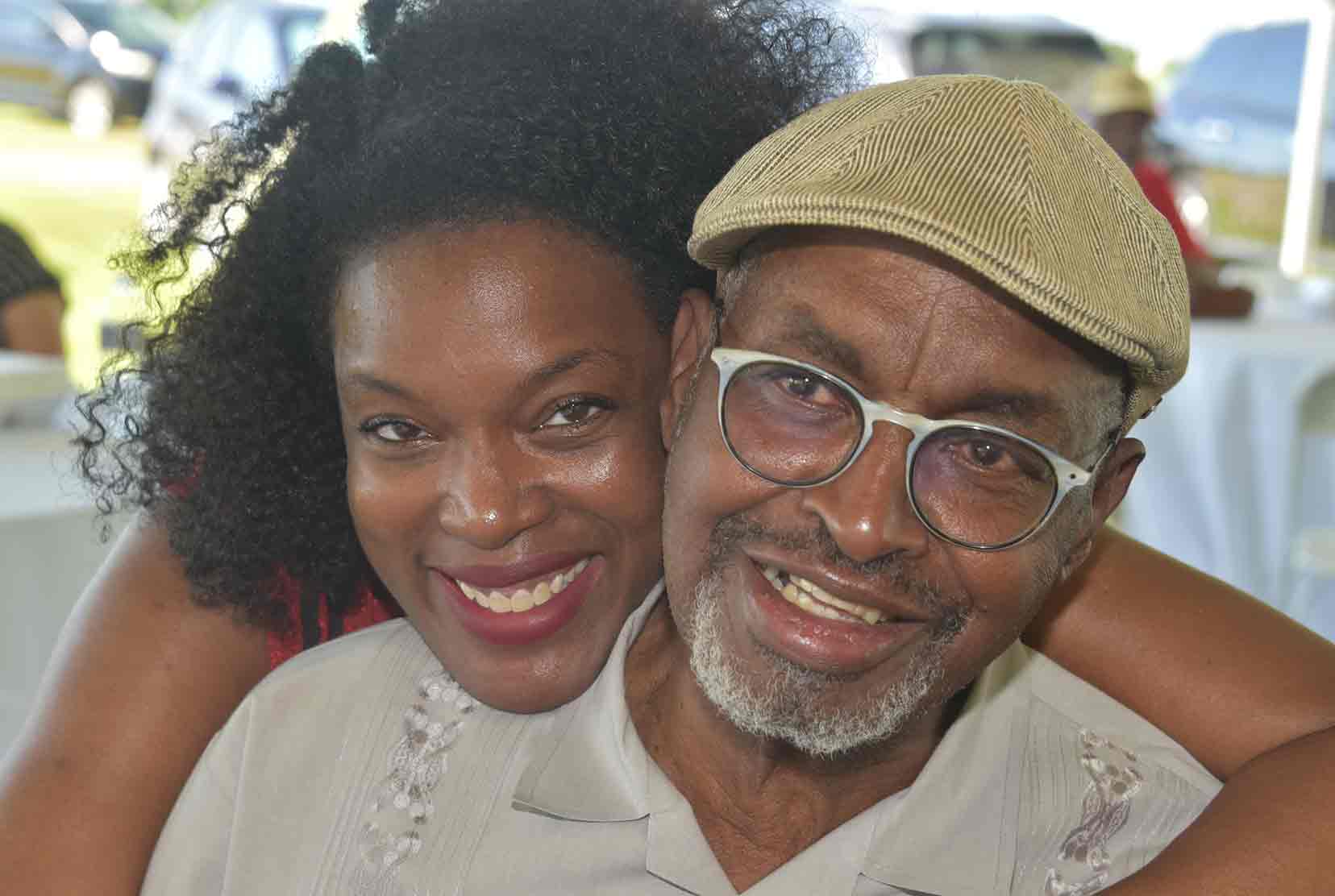 Acting CAST Dean Cherese Winstead-Casson poses affectionately with retiring CAST Dean Dr. Dyremple Marsh during a June 29 reception in his honor held at the Delaware State University Outreach and Research Center near Smyrna.