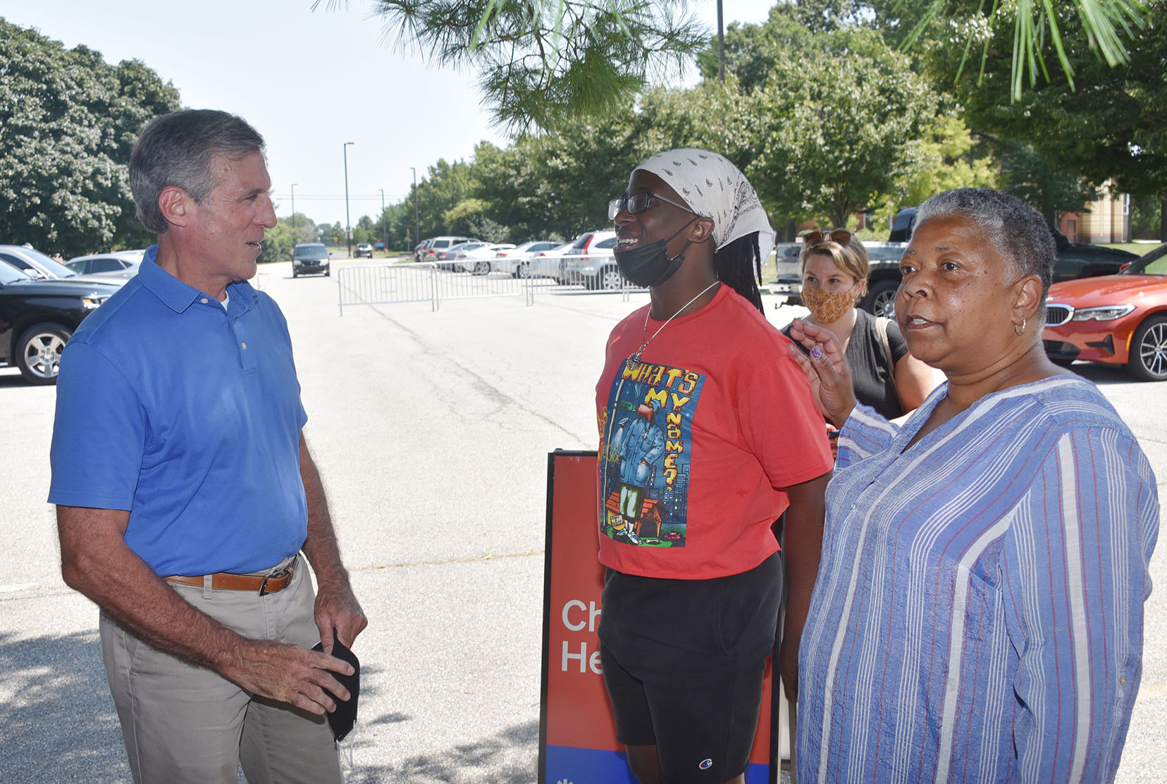 Rev. Rita Paige (r) of the Kent County Vaccination Coalition introduces Kendrick Hicks to Delaware Gov. John Carney and the others gathered there. Mr. Hicks, a Del State senior, recently participated in a recent Real Talk panel discussion designed to encourage people to get vaccinated.  