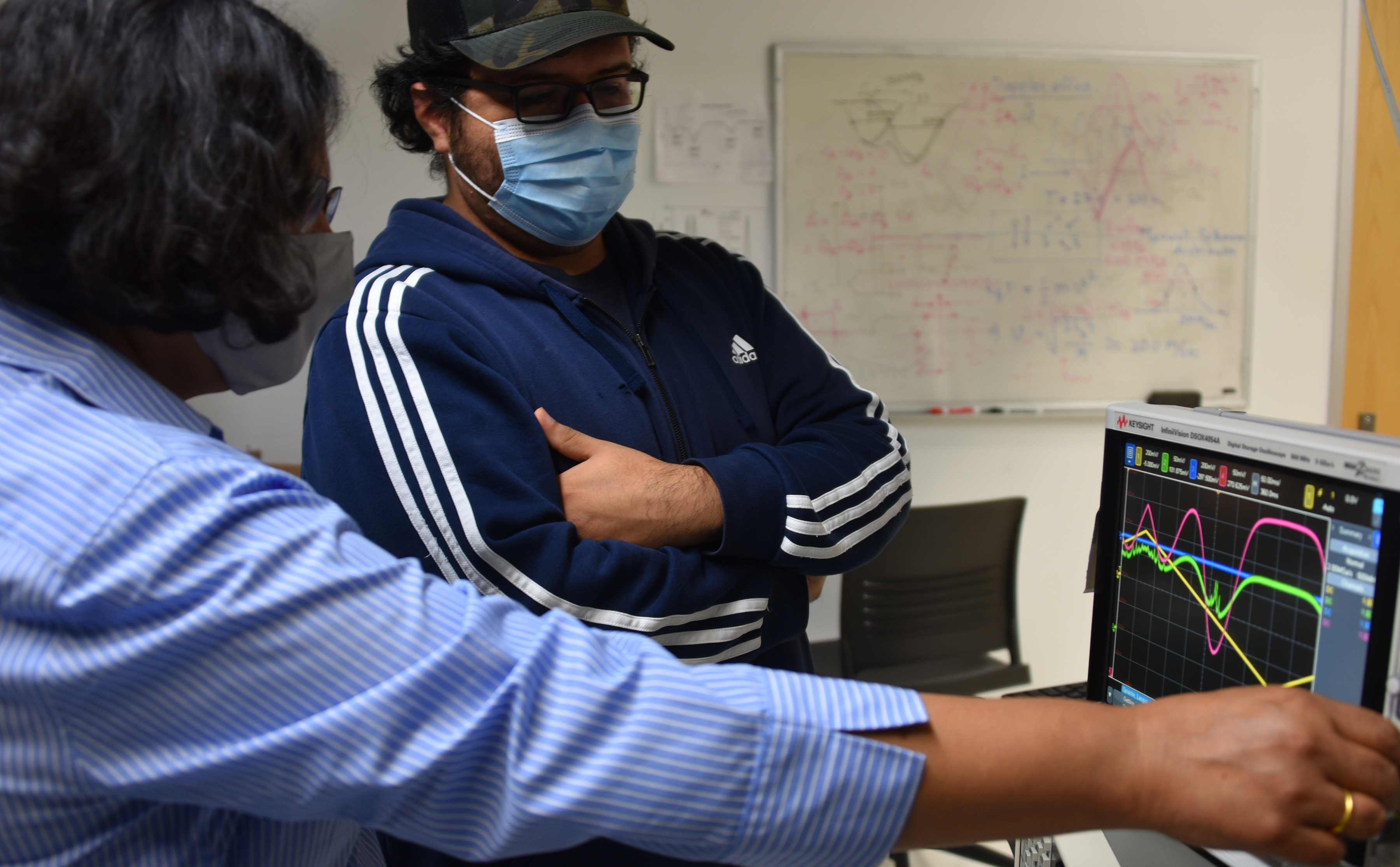 Del State affiliation with the National Science Foundation's I-Corps Northeast Hub is expected to better position the University to move the fruits of its diverse research portfolio into the economic market, such as the pictured optics work in making improvements to high technology sensors. Pictured are Dr. Renu Tripathi (l), Professor of Optics, and Mauricio Pulido, a graduate student in optics.