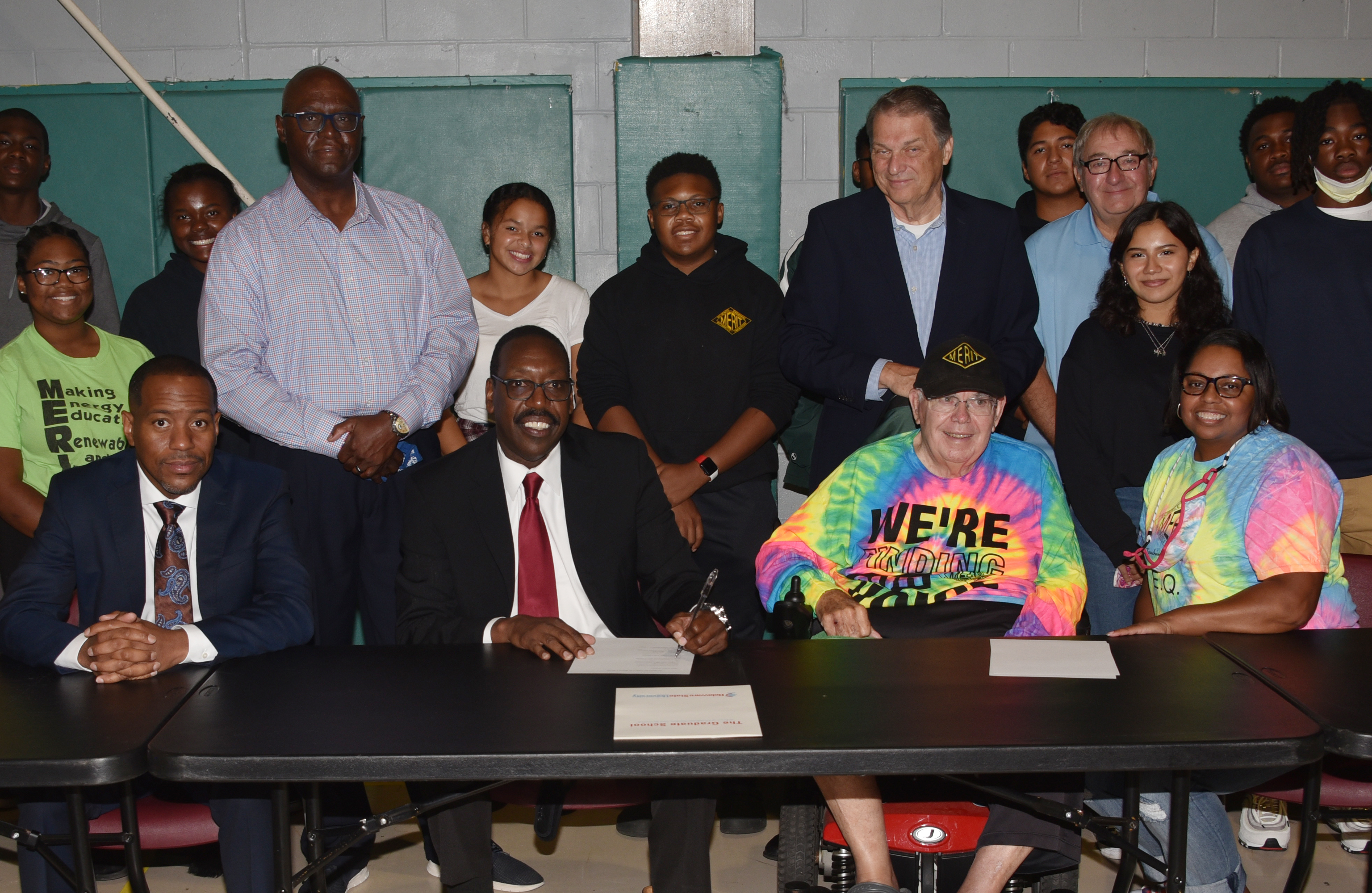 (L-r seated) Del State's Kareem McLemore and Dr. Darren Blackston, along with MERIT's John Hollis and Nika Reid, pose after signing an agreement between the two entities, in which Del State commits to providing higher education services to the MERIT high school-age youths.