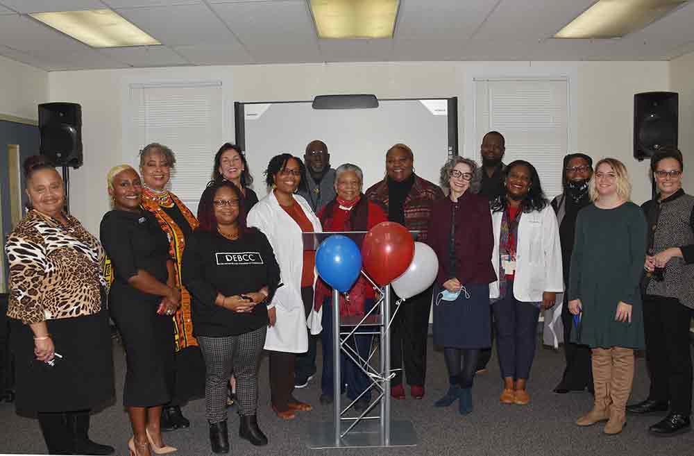 Many of the attendees of the Nov. 16 Open House for the University's new Biomedical Behavioral Allied Health Center -- formerly the Capital Park Community Center -- gathered for a Kodak moment.