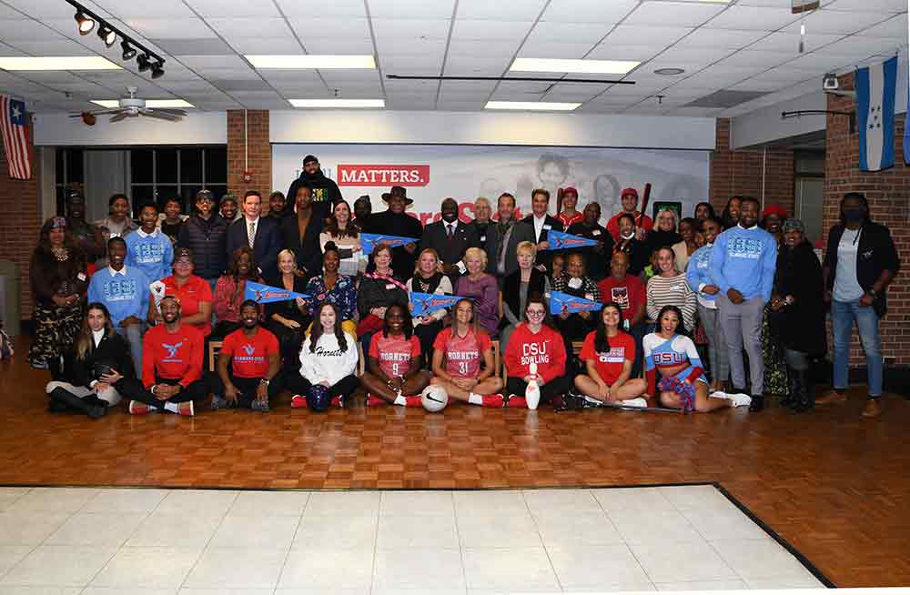 Downtown Dover Merchants pose with Del State student-athletes and officials after a spirited "Meet & Greet" event that reflected a community excited about the new DSU Downtown campus