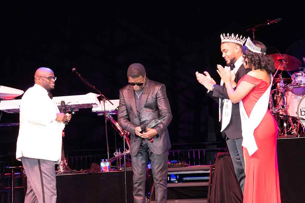 Kenneth "Babyface" Edmonds (center) humbly accepts DSU's Lifetime Achievement Award from Dr. Tony Allen (l) while Mr. and Miss DSU Jason Smith and Jewell Phillip (r) applaud him.
This and all other photos in this article are by Bernard Carr.