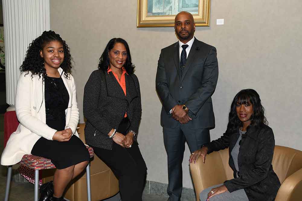 (L-r) Shannon Henry, Troy Farmer, COB Dean Michael Casson, and LIllie Crawford of the College of Business will lead the work of implementing the Community Navigator Program to help small businesses in Dover -- and especially in the downtown area of the state capital.