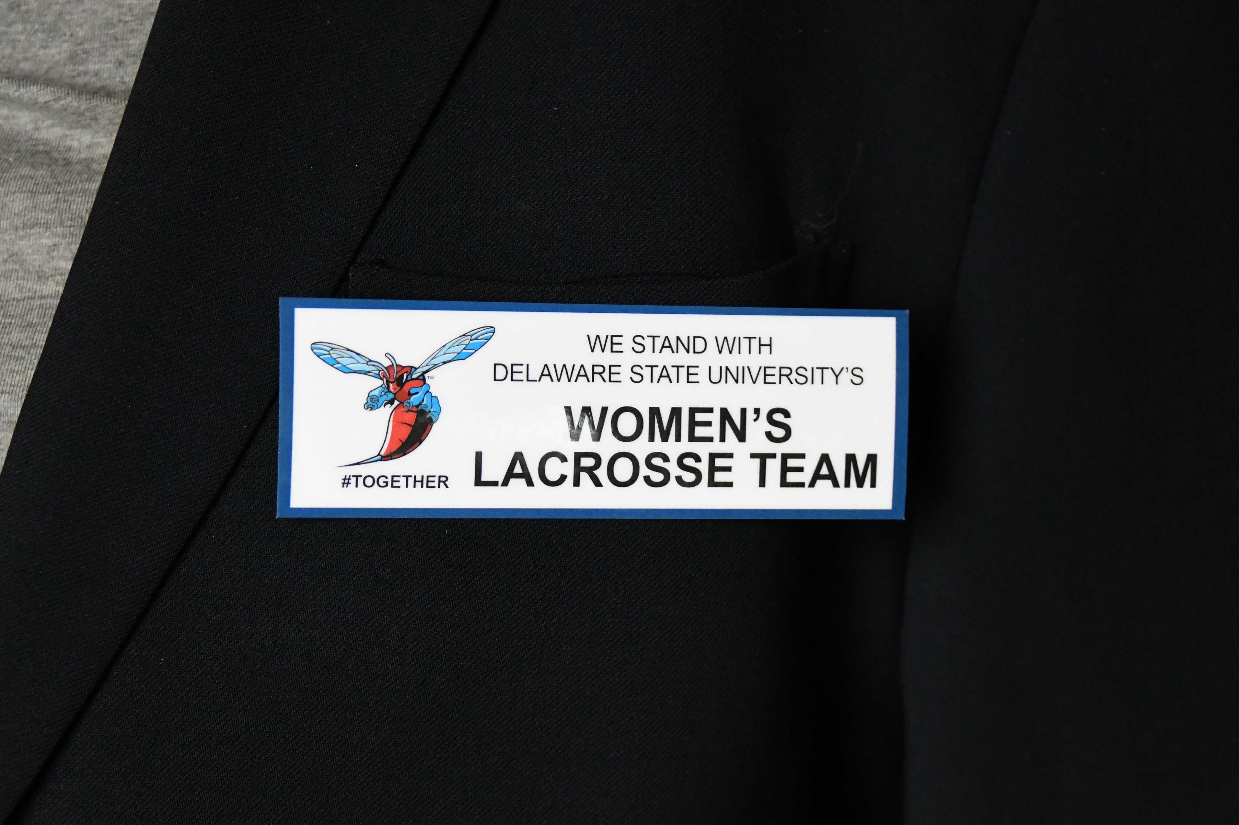 The pictured badge was worn by commencement speakers and workers in solidarity with the Women's Lacrosse team, which was subjected to an improper stop and search in Georgia by the Liberty County Sheriff's Department.
