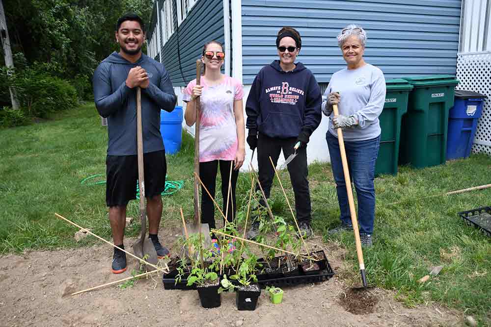 (From l-r) Brentdy Chevez of First State Community Action, and from the University, April Roeper, Dr. Cynthia Newton, and Leslie Taylor pause for a pose during their project to establish a community garden at the DSU-Capital Park Community Center.
