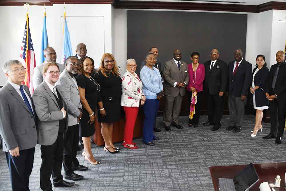 Delaware State University officials pose with Jamaican Ambassador Audrey P. Marks and officials from the University of West Indies (Mona Campus) take a break from May 27 meetings to pose for a group shot.