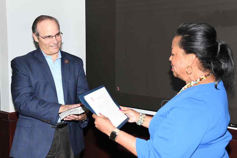 Chip Rossi, Bank of America Delaware Market President, is sworn in as the University Board of Trustees' newest member by Board Chair Dr. Devona Williams during the June 15 regular Board meeting.