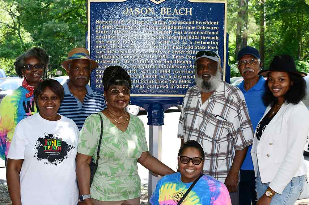 University alumni at the Jason Beach historic marker: Yolanda Yarborough Hutson, '82; Sherron Cooper Becton, '75;Clyde L. Selby, '76; Otella Maull Oliver, '62;Nika Drew Reid, '94; Clarence Selby, '78;Paul M. N. Selby, '67; and Jere' Hutson, '14.