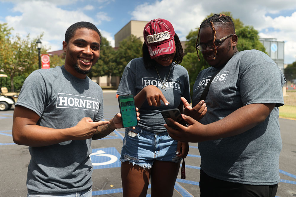 A trio of Delaware State University students gets excited about the new all-inclusive DSU HUB app which was launched during Welcome Week. The app -- which can be obtained for free at app stores for Apple or Android -- provides greater connectivity for students as well as the rest of the University community.