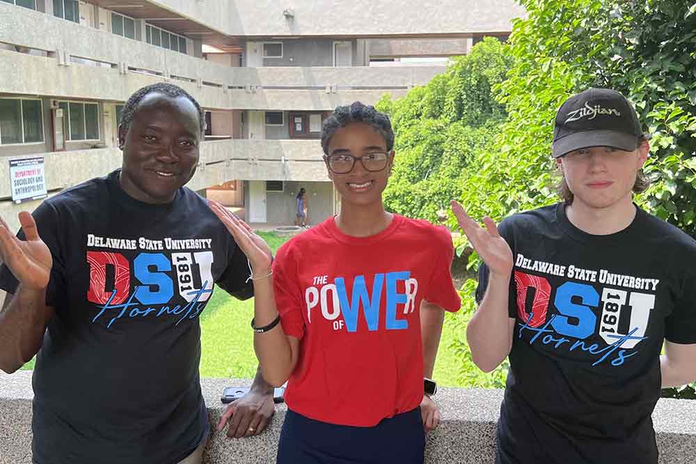 Dr. Raymond Tutu, Chair of the Department of Sociology and Criminal Justice, and University students Maya Bythwood and Donovan McNatt stop for a photo pose during the visit to the University of Cape Coast in Ghana.