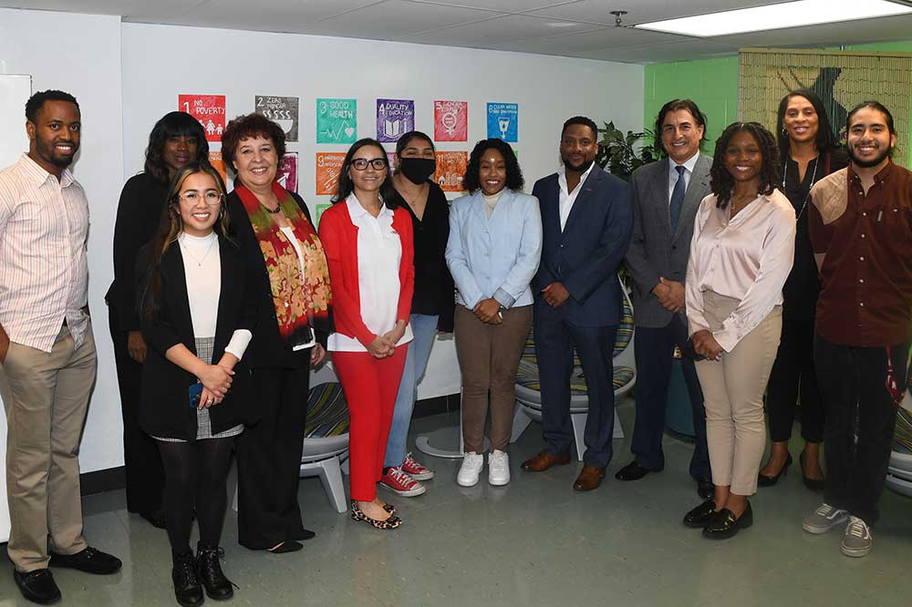 University students and faculty pose with representatives of DuPont and DESCA during an Oct. 25 event in the Bank of America Building. Held in the The Garage on the mezzanine level, the students learned about some of the contemporary career paths that await them.