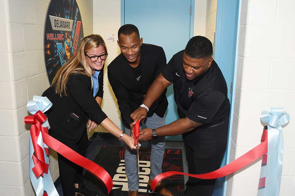 (L-r) Jordin Williams, Executive Director of the Wellness and Recreation Center, Julian Fitzgerald, Executive Director of Cxmmunity Gaming Co., and Wesley Davis, Assistant Director of Facilities Operations, cut the ribbon on the new eSports Lounge and Tech Center.