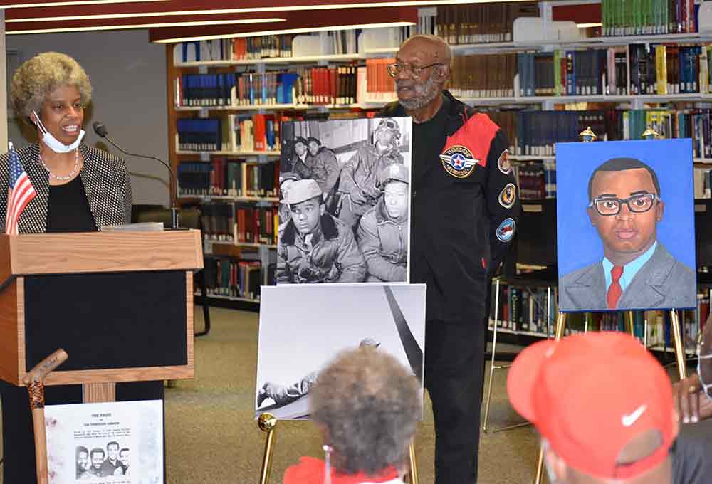 A portrait of Delaware State University graduate and U.S. Marine Capt. Larry F. Potts, who was lost on April 7, 1972, in an aerial mission over South Vietnam, was unveiled at a Veterans Day ceremony on campus. Alumni Dr. Rosetta Roach, the artist, and Dr. Donald Blakey, President of the John H. Porter-First State Chapter-Tuskegee Airmen, Inc., are pictured.
