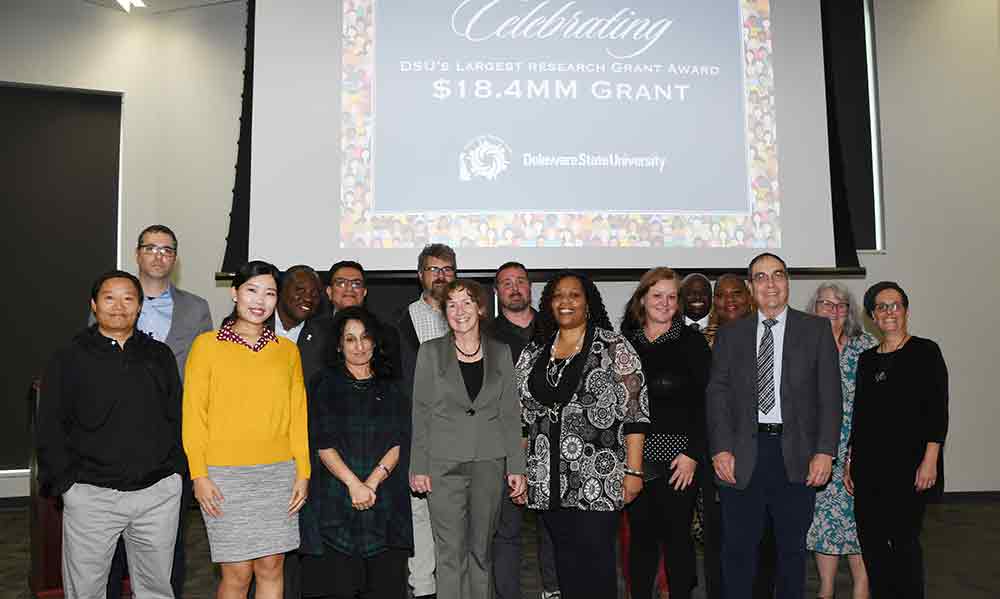 The Interdisciplinary Health Equity Research Center team gather for a group shot during the Nov. 30 media event in which the University celebrated the award of a school-record five-year $18.36 million research grant from the National Institutes of Health.
