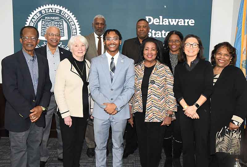 Jordan Spencer (center) has become the first student to serve on a University Board of Trustees committee. In the picture with him are Board members (l-r) Harold Stafford, Norman Griffiths, Lois Hobbs, Leroy Tice, John Ridgeway, Dr. Devona Williams, Dr. Debbie Harrington, Jocelyn Stewart, and Dr. Wilma Mishoe.