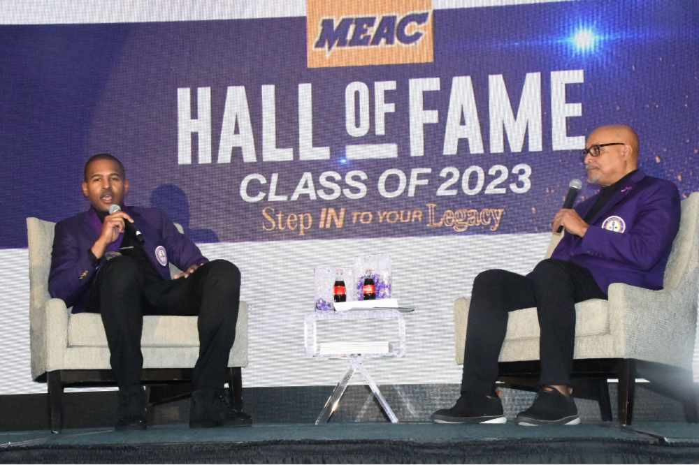 Jahsha Bluntt (l) is interviewed by an emcee during the MEAC Hall of Fame induction ceremonies. In addition to the induction of Bluntt -- the eighth MEAC Hall of Fame inductee from Delaware State University -- the conference also recognized Maxine Lewis as the University's 2023 Distinguished Alumnae. 