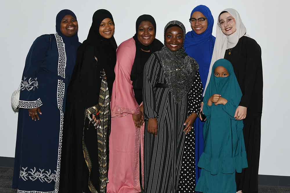 Gathering for a photo during the April 18 Ramadan event on campus are (l-r) Tasiyah Sheppard, Sakeenah Abdul-Malik, Myla Fountain, Roqibat Oluyadi, Anissa Cartagena, Alan ir Johnson, and Yaren Kandaz, Alan Ir. Johnson.