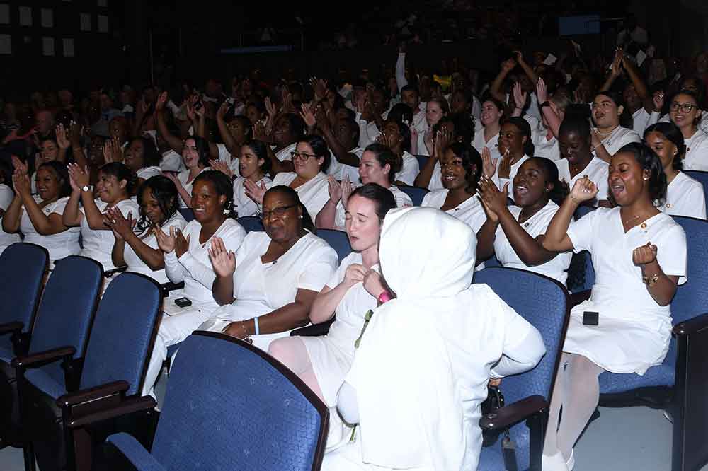 The Nursing Class of 2023 celebrates after receiving their nursing pins during a ceremony in the Dr. William B. DeLauder Education and Humanities Theatre on May 11.