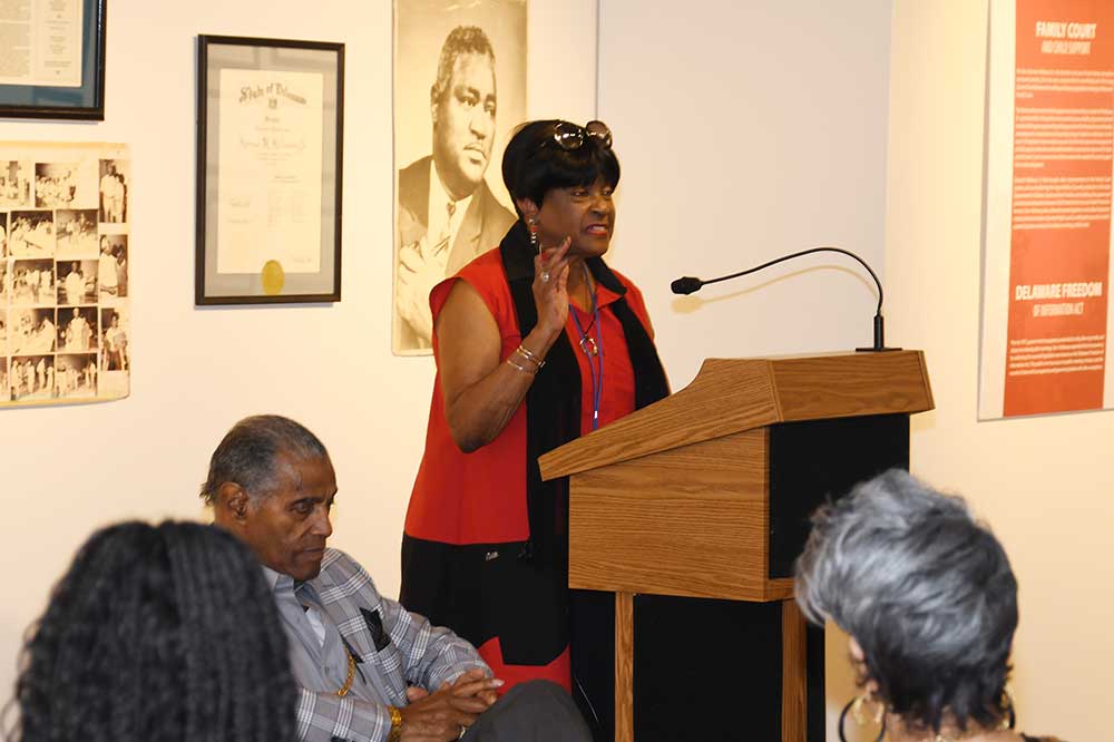 DSU Alumna ('69) and State Rep. Stephanie T. Bolden recounted how she worked on the campaigns of her cousin Sen. Herman Holloway Sr. during a program that celebrated the life and legacy of the late senator. Seated next to the podium is his son Herman Holloway Jr. 