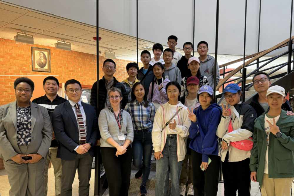 A group of students and teachers from the Yunnan People Foreign Friendly Association of China pose with DSU officials at the William C. Jason Library during a Nov. 8 visit to DSU.