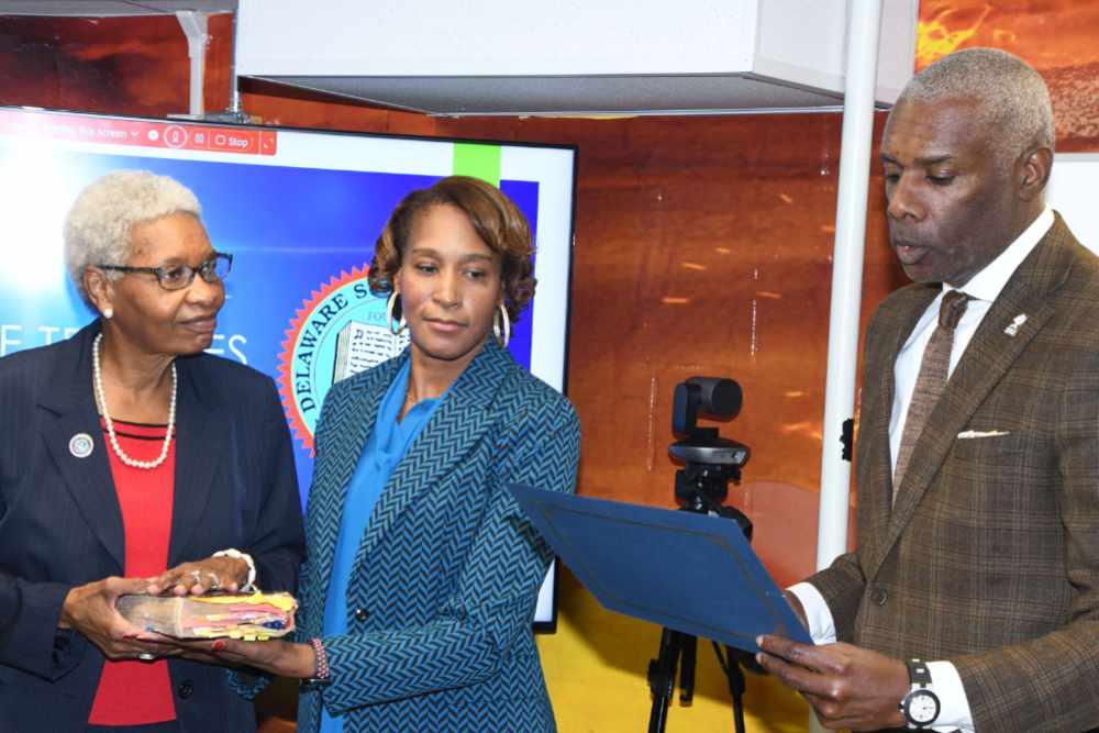 Dr. Marlene Saunders (with the Bible beheld by Board Secretary Tamara Stoner) is sworn in as the newest member of the DSU Board of Trustees by Board Chair Leroy Tice. Dr. Saunders is an alumna and a former long time faculty member in the DSU Department of Social Work.